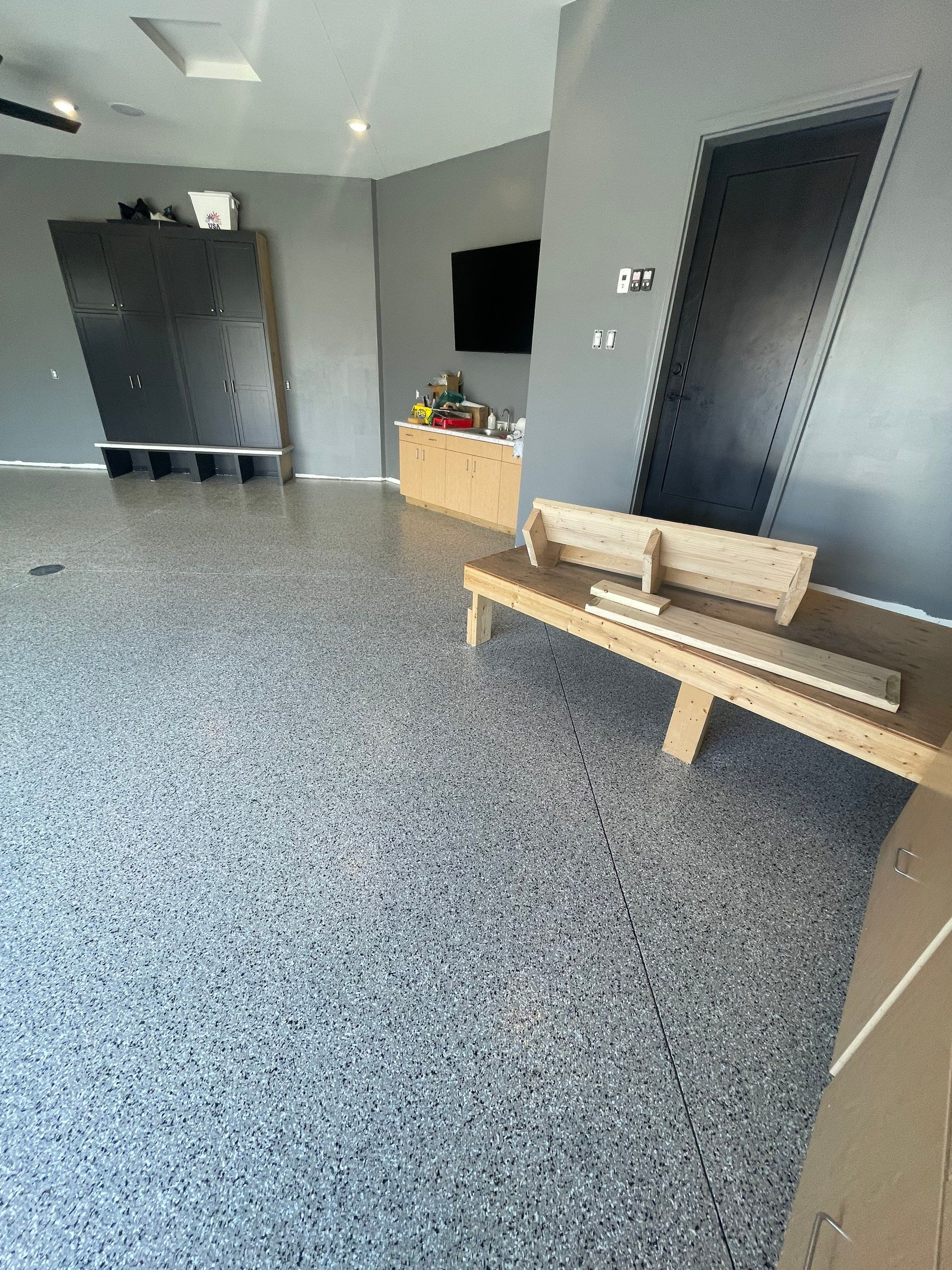 Custom Speckled Concrete Coating for Dell Rapids Garage by Select Painting, Coatings & Garage Cabinets