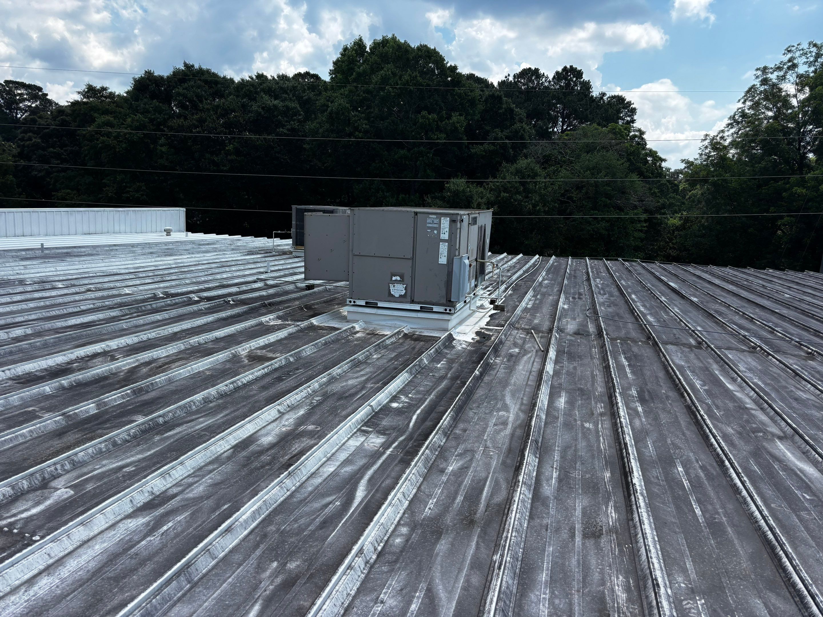 12,180 SQ Ft Commercial Metal Roof Restoration in Clarkston by Southern Roof Solutions