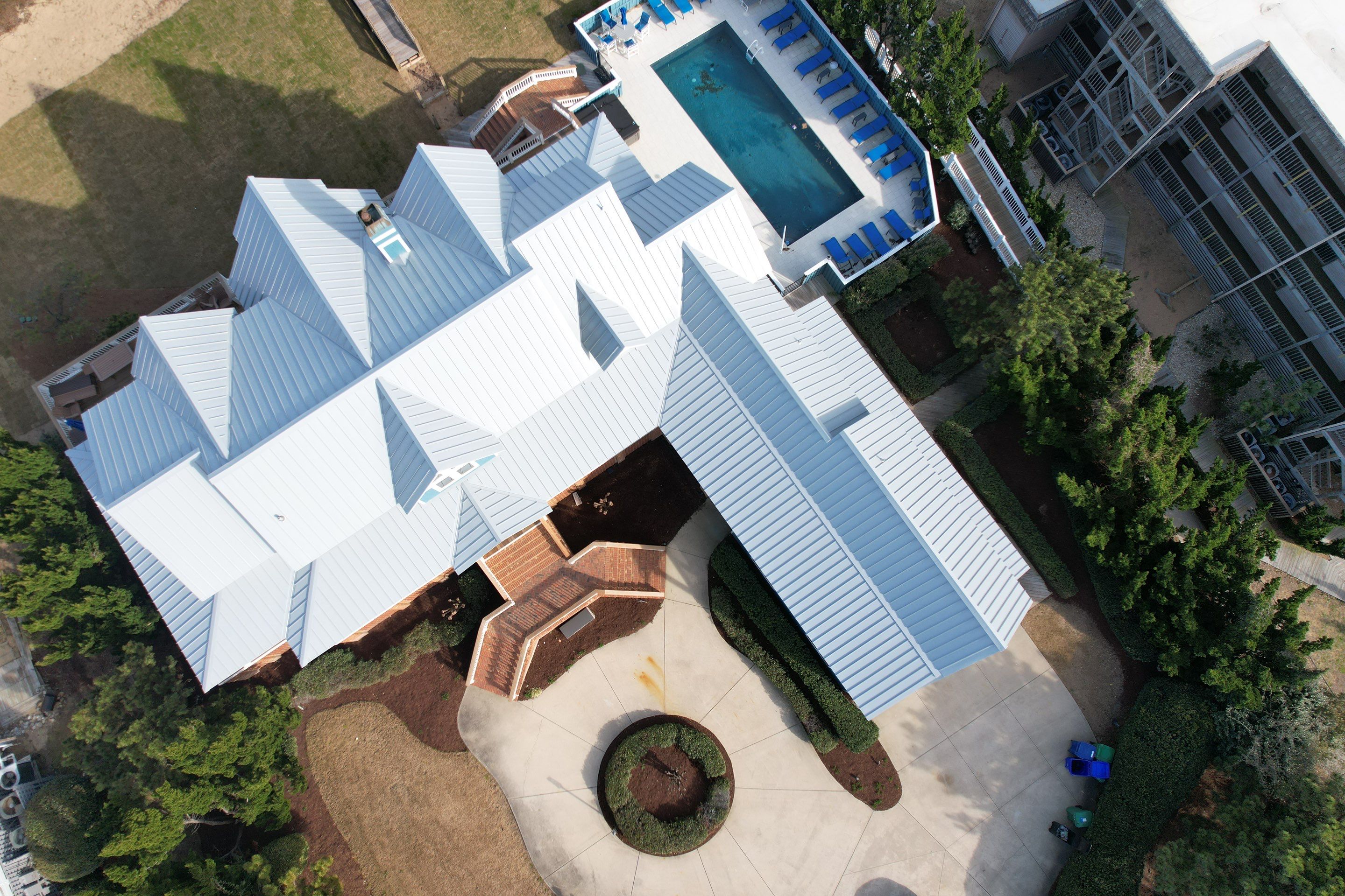 Large Metal Roof Transformation by Gallop Roofing & Remodeling, Inc.