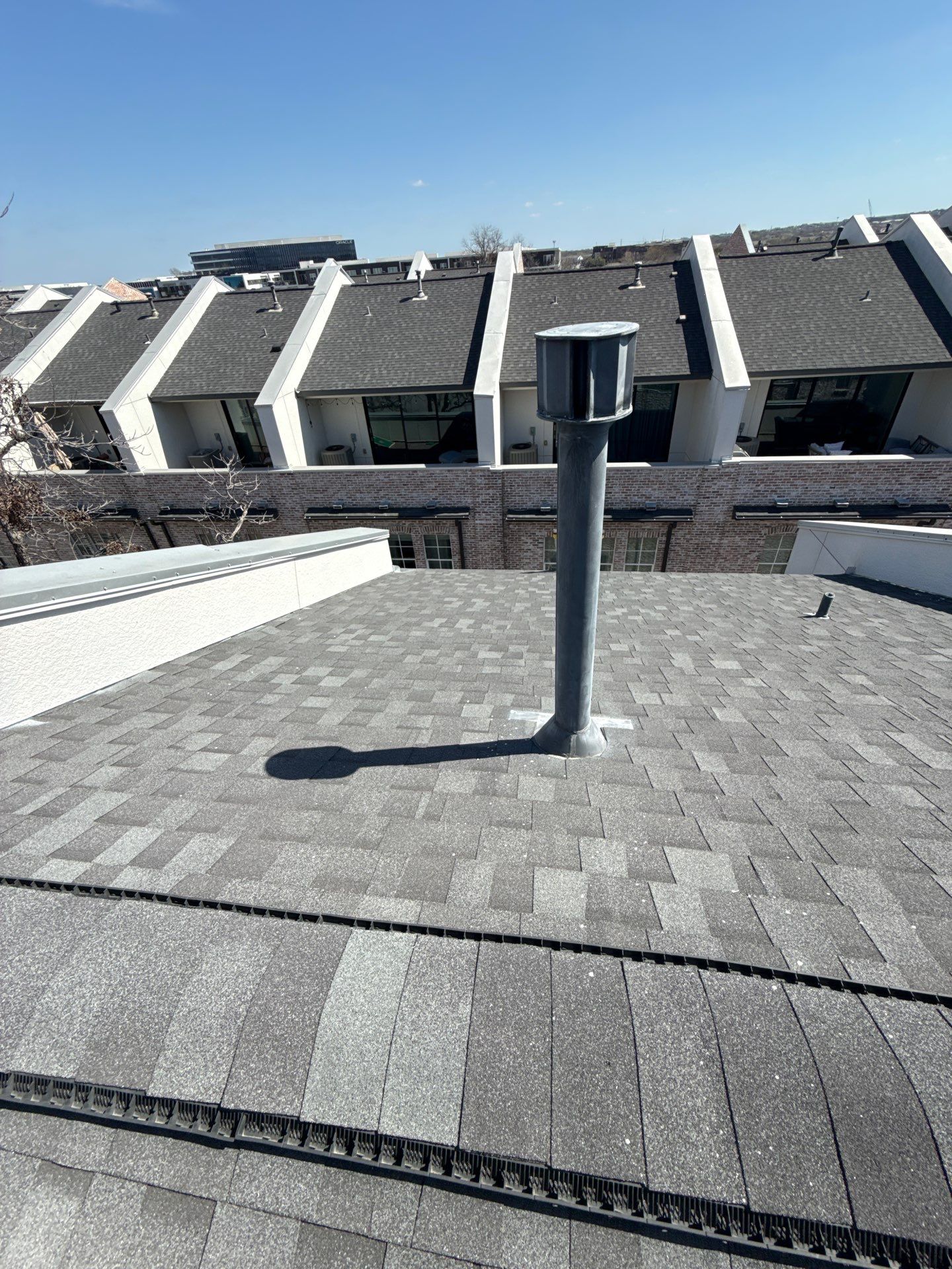 Residential Roof Replacement using TAMKO -  Stormfighter IR - Rustic Black by Action Exteriors Austin