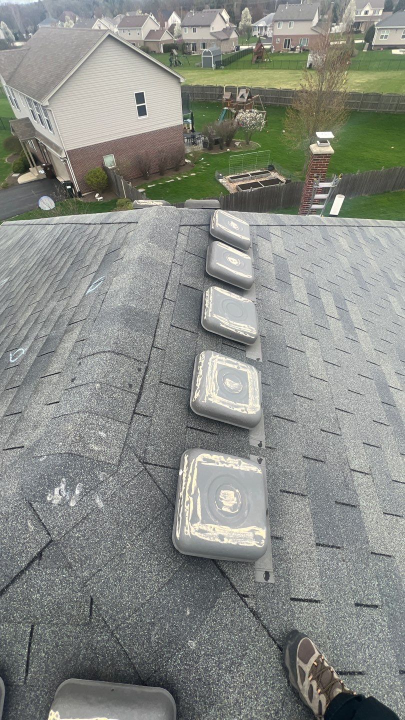 New black gutters and roof by Optimal Home Improvement 