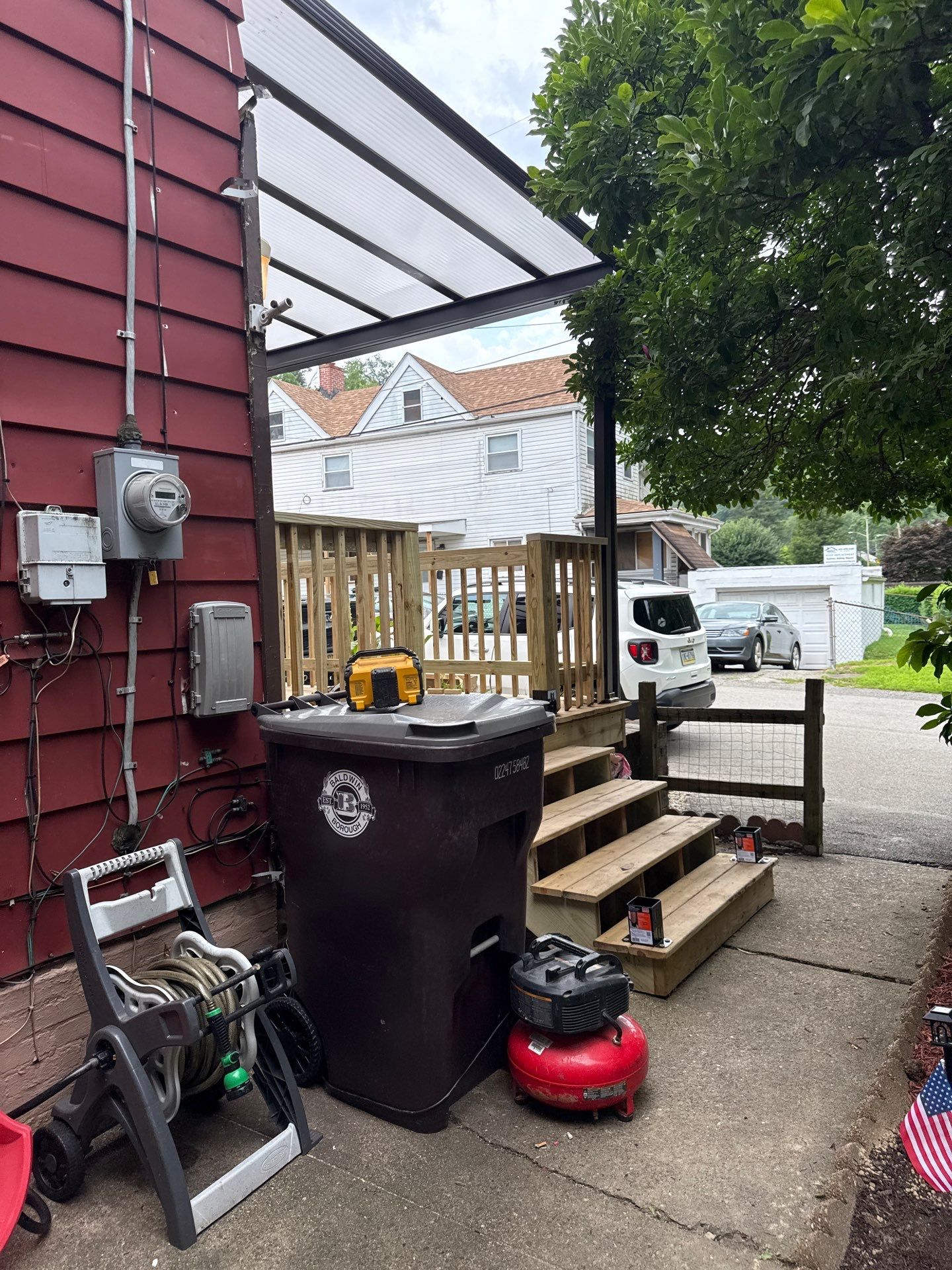 Roof sunspace deck  by Cousins Roofing Siding & Decks