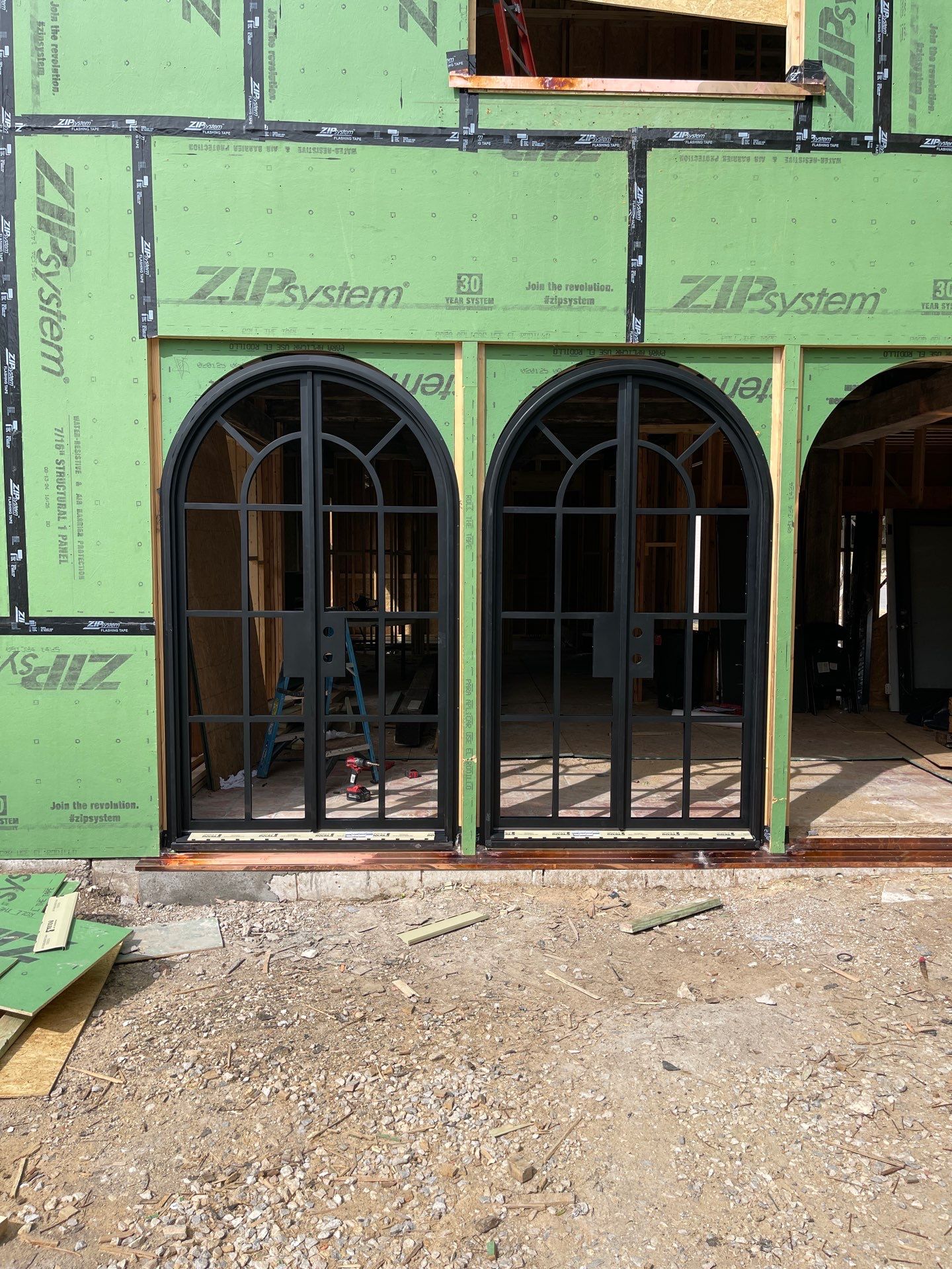Arched Black Metal French Door Installation and Finishing in Fort Worth by Solara Custom Living