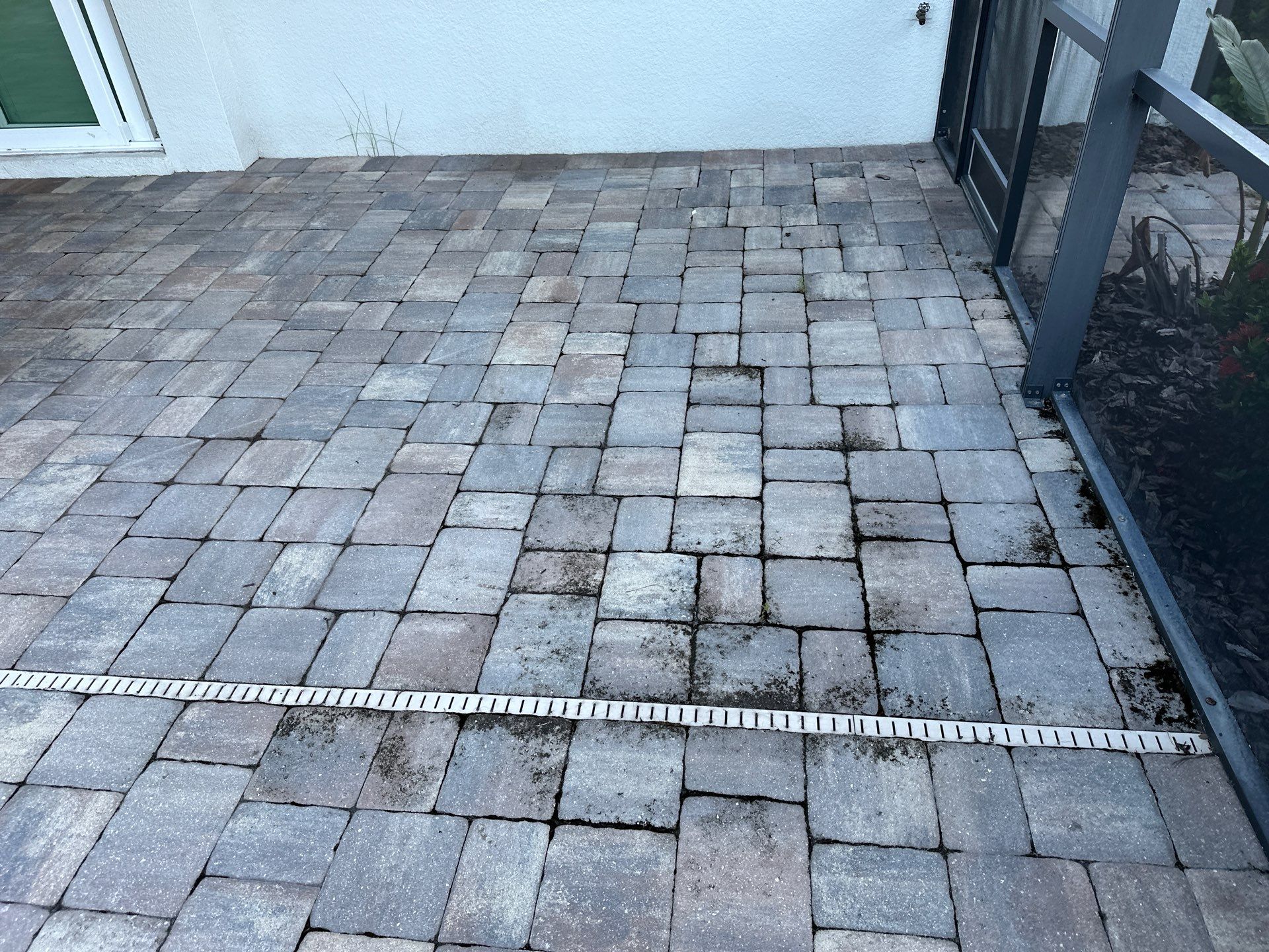 Paver Driveway, Sidewalk, and Pool Deck Cleaning in Winding River Community, Bradenton, FL by Sunshine AquaWash