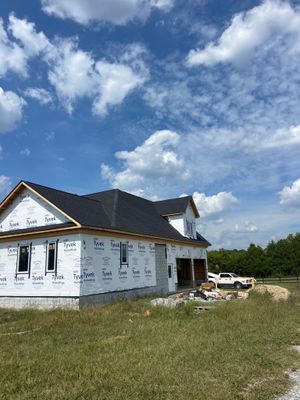 Residential Roofing Installation using Tamko Heritage AR with Standing Seam Metal Porch