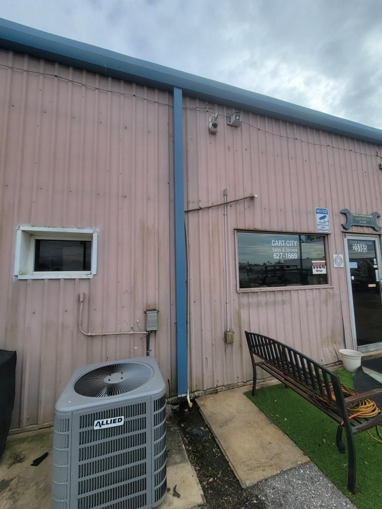 Black Aluminum Gutters with Matching Downspouts in Port Charlotte, FL by Gutter Professors