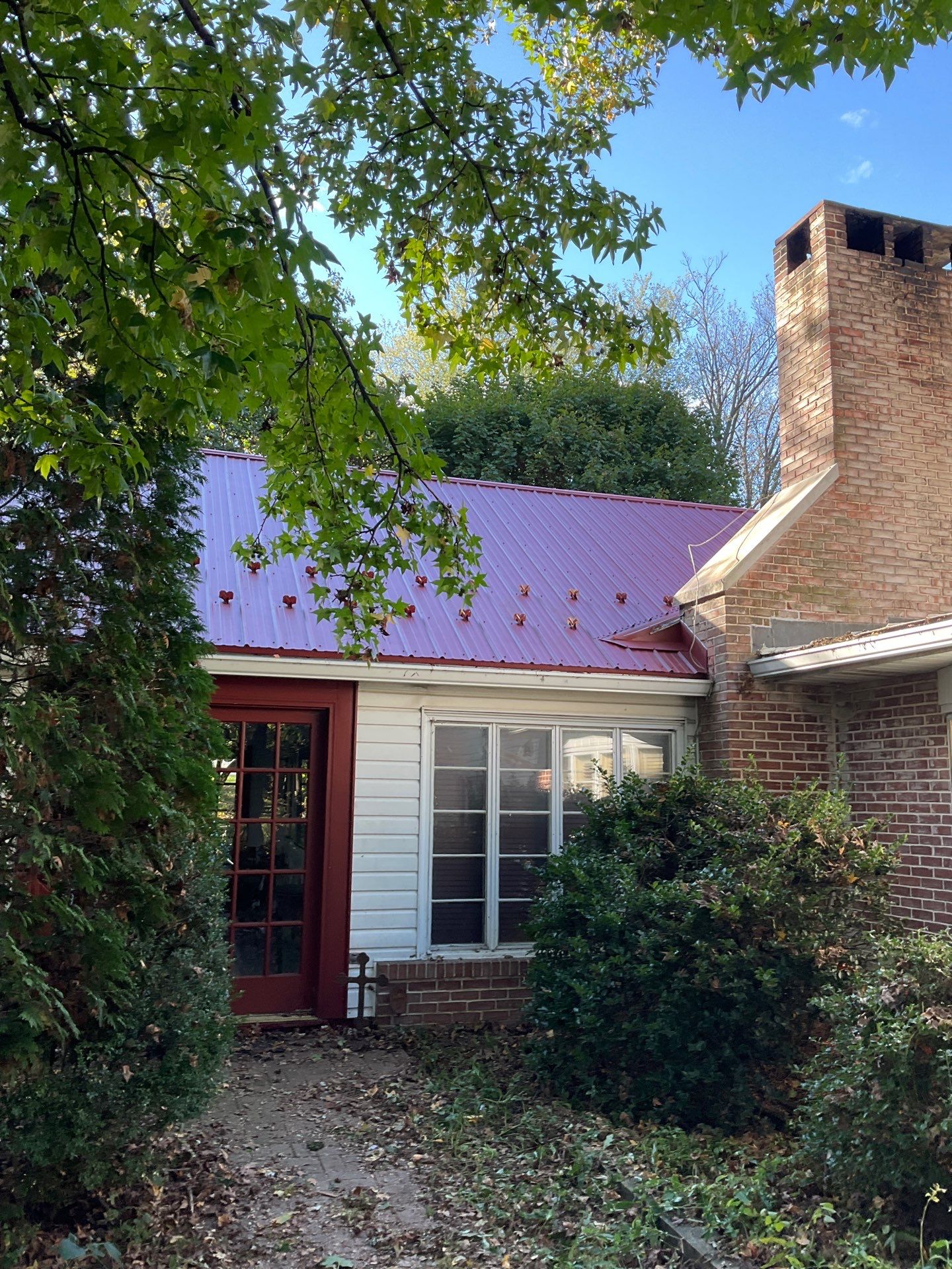 Red Metal Roofing Installation and Trim Restoration in Bernville by Esh Builders