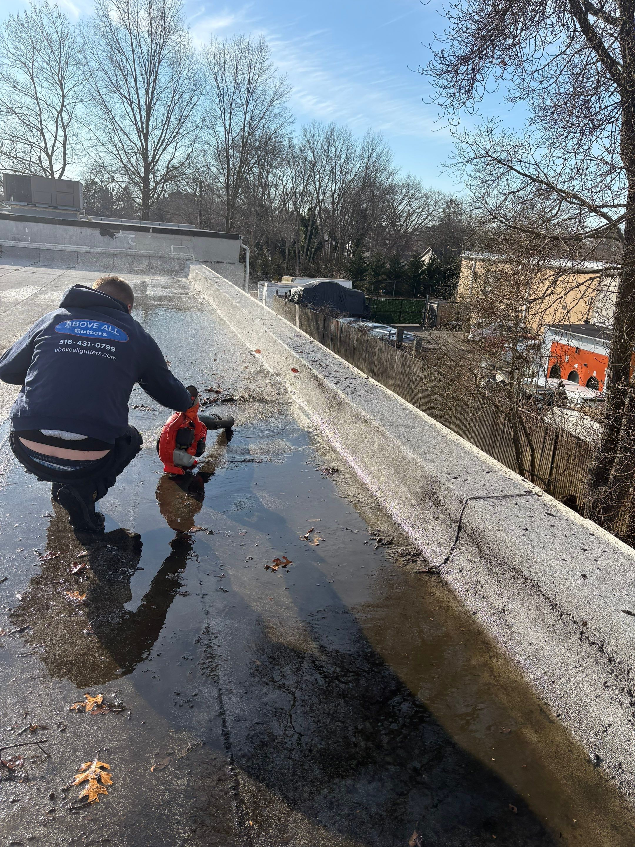 Bohemia Flat Roof Cleanup  by Above All Gutters 