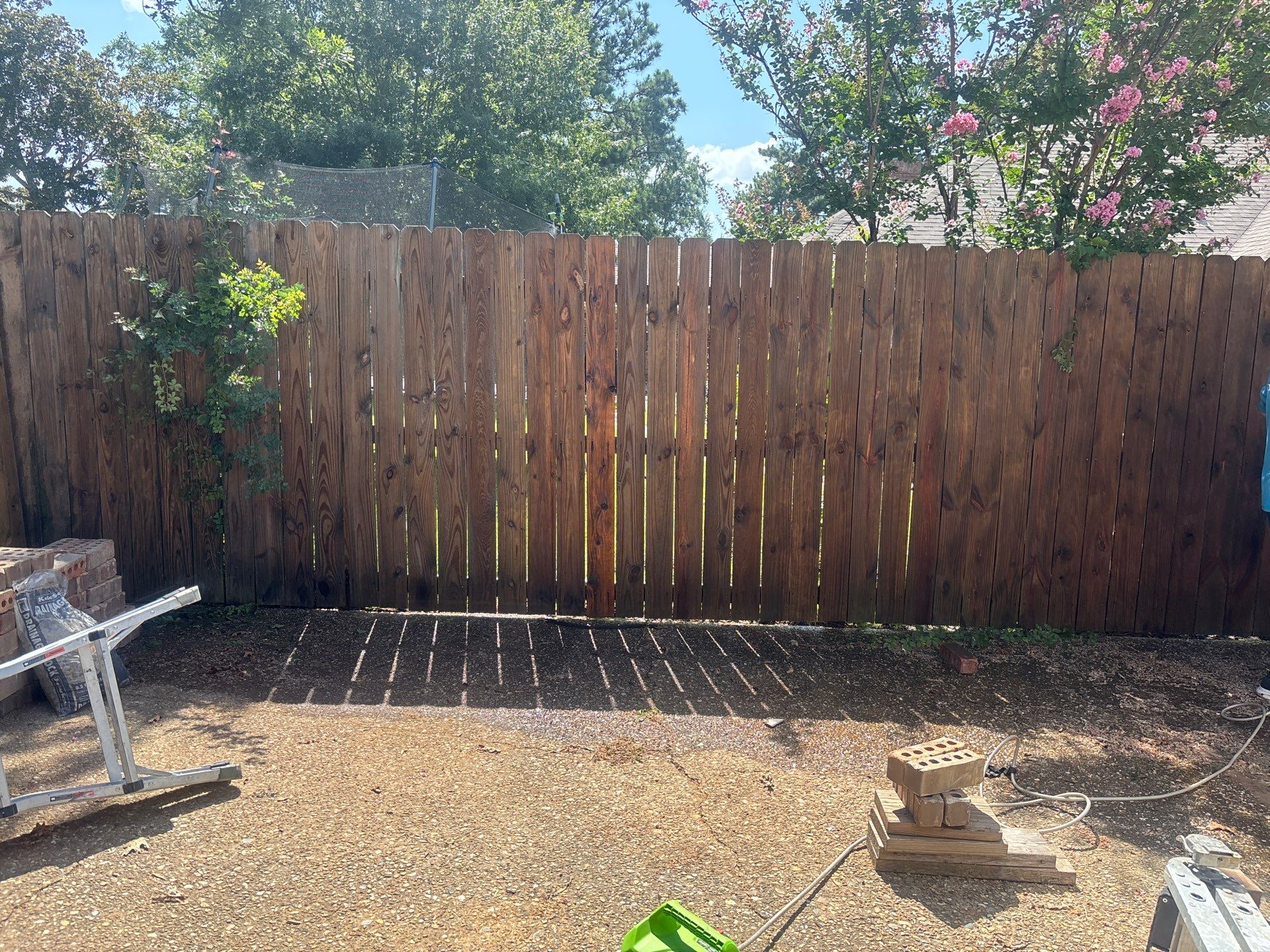 Project in TylerExterior Painting in Tyler, TX | White Brick Home, Varnished Fence & Shed Painting by Quality Coats Painting