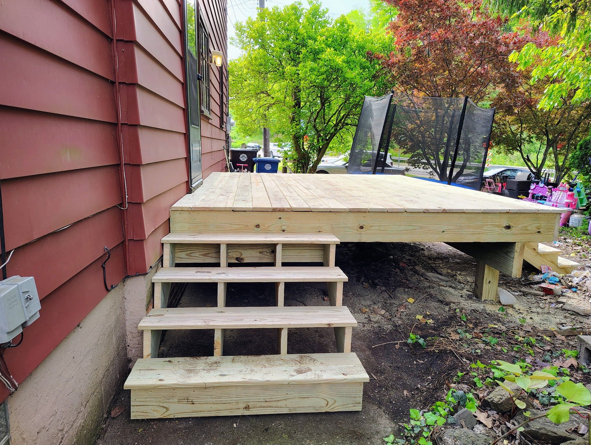 Roof sunspace deck  by Cousins Roofing Siding & Decks