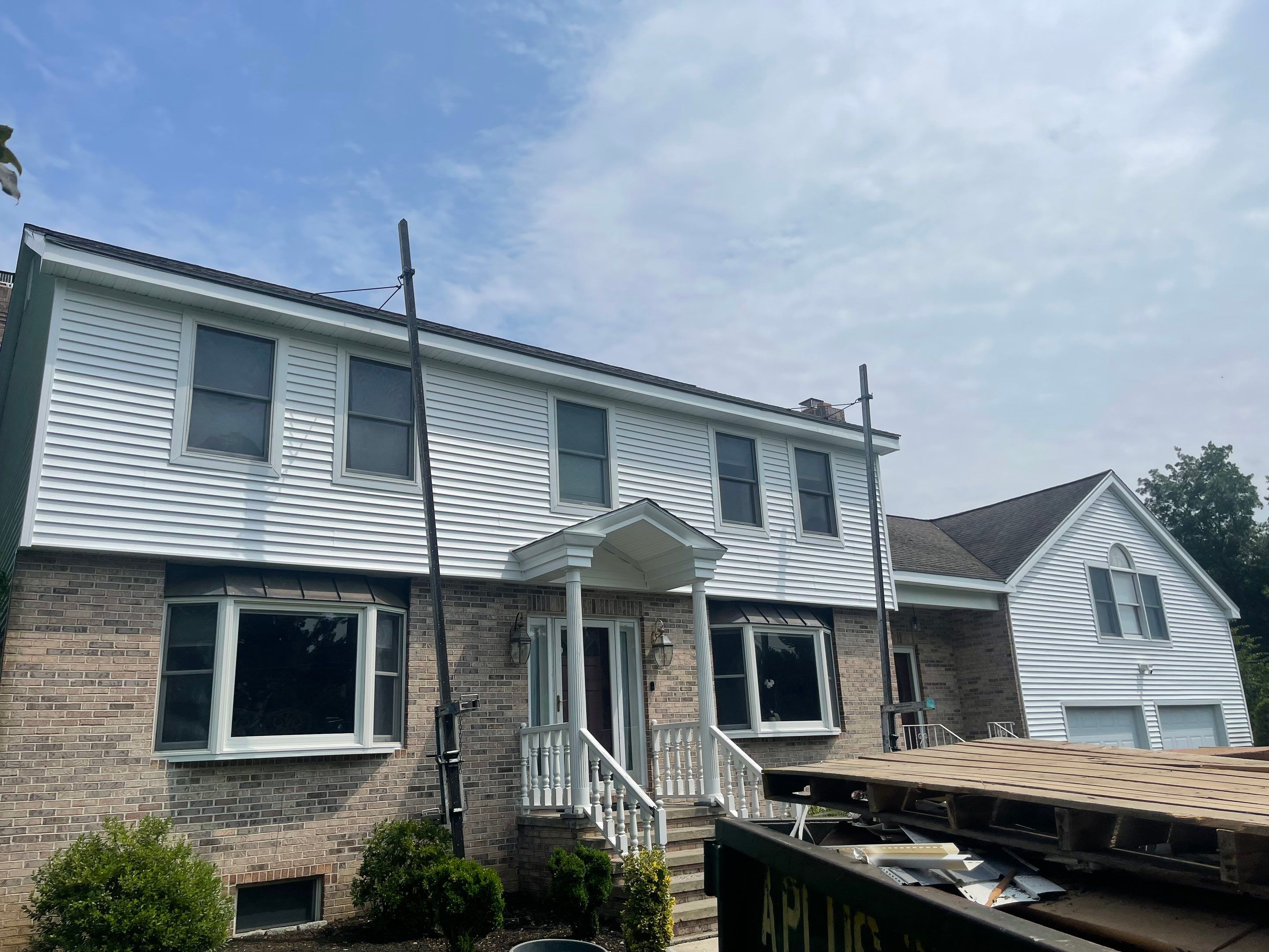 Siding Installation using Mainstreet Colonial & White gutters by A Plus Exterior