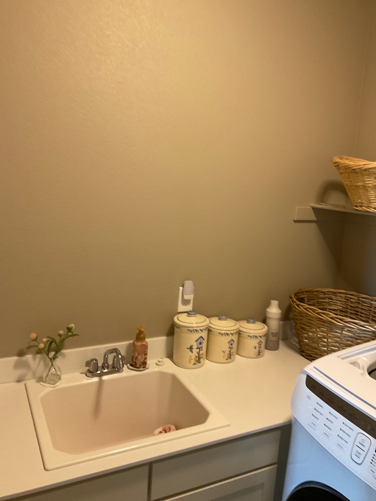 Laundry Room designed to match closets by Concept 32, Inc.