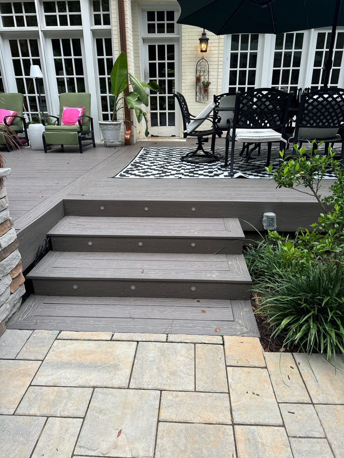 New Deck, Stone Fountain Feature, Circle Stone Sitting Area with Fireplace by The Remodeling Company