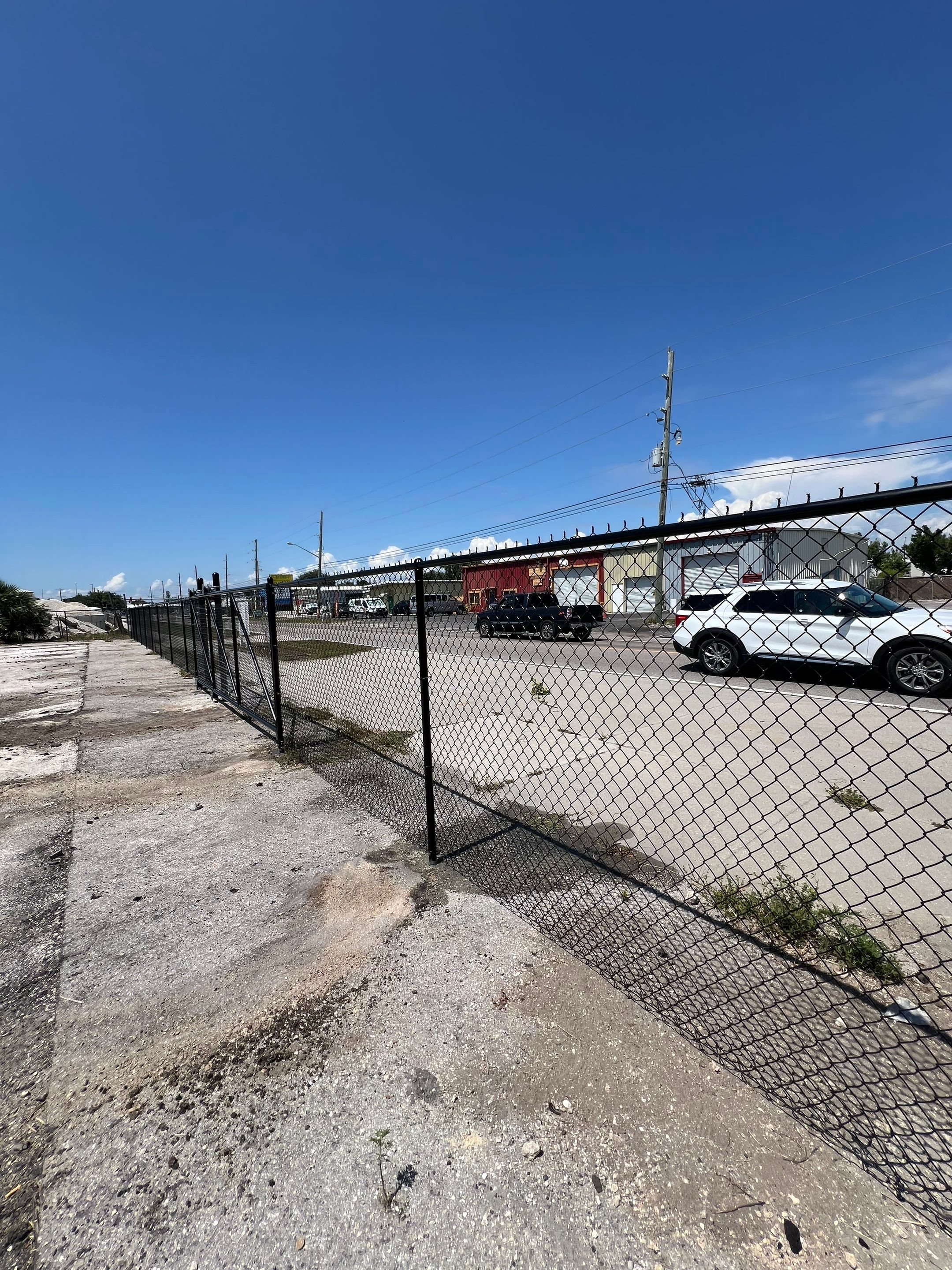 Chain-link Fence Installation using 6ft Black Chain Link Fence  by Asap fence and gates, LLC
