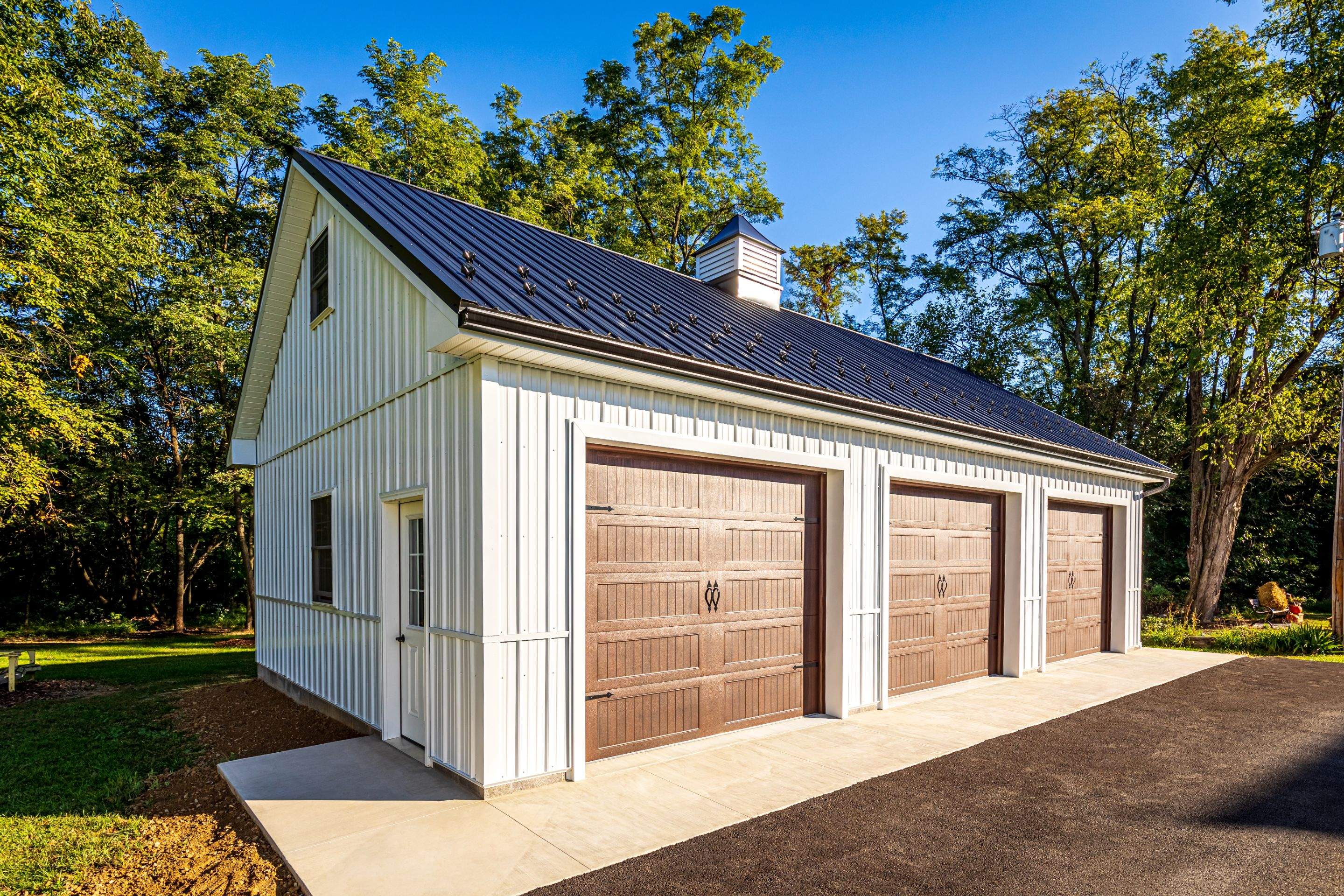Metal Roof-black New Garage by Esh Builders