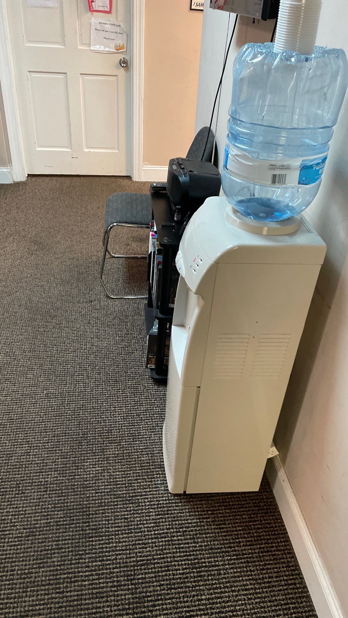 Office Remodel from Worn Out Carpet to Sleek Glued Down LVP by Footprints Floors of Coastal Carolina