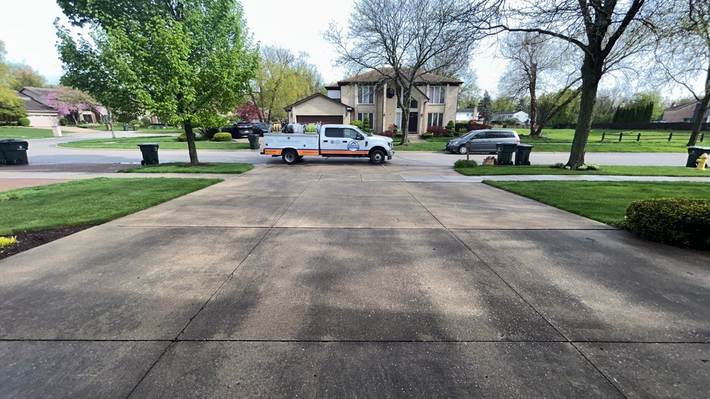 concrete patio and driveway cleaning by Northern Power Washing LLC.