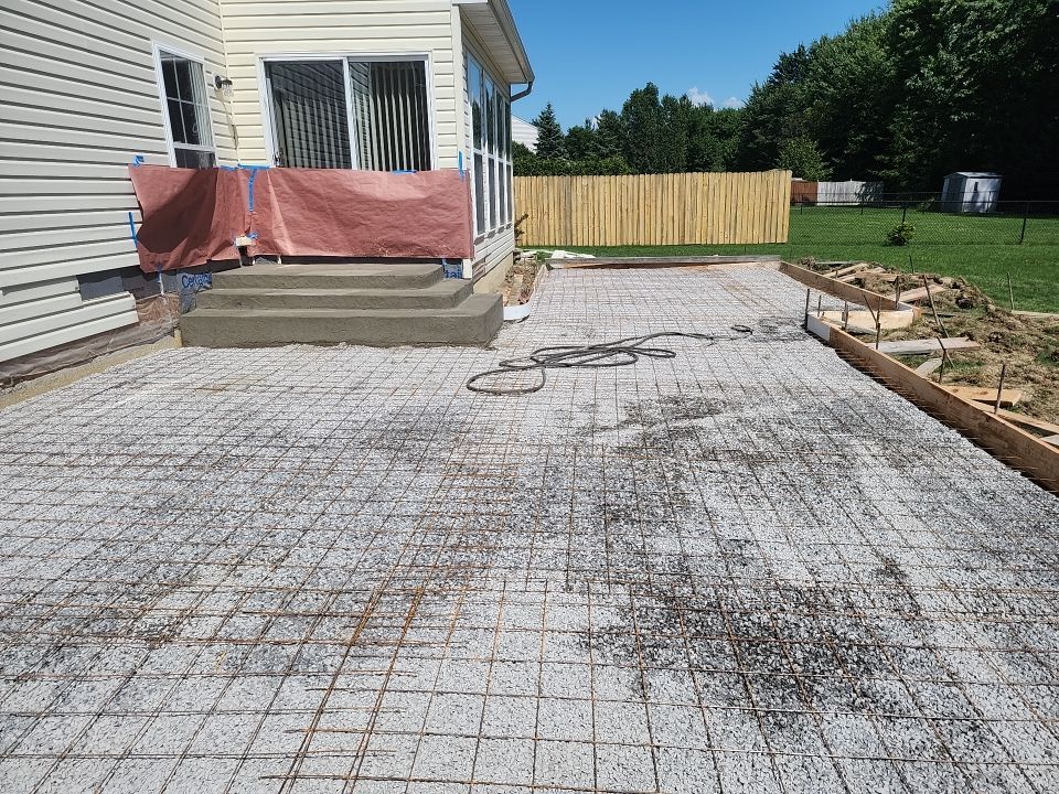 Stamped Concrete, Entry Door, and Concrete  by Ivy Lea Construction