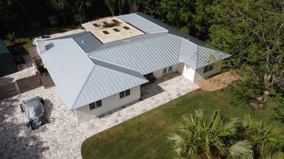 Residential Roofing Installation using 1" Nail strip metal roof