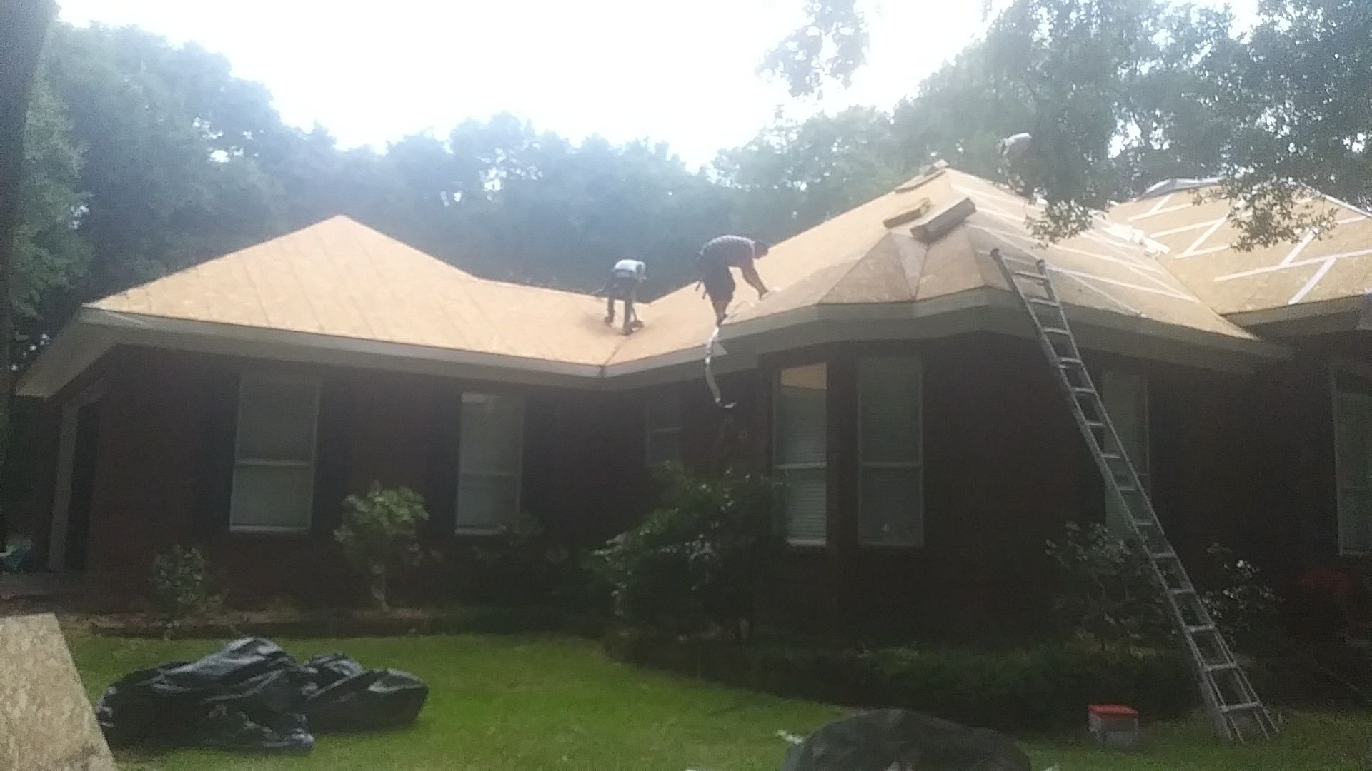 Residential Roofing Installation using Metal roofing by American Roofing & Construction LLC