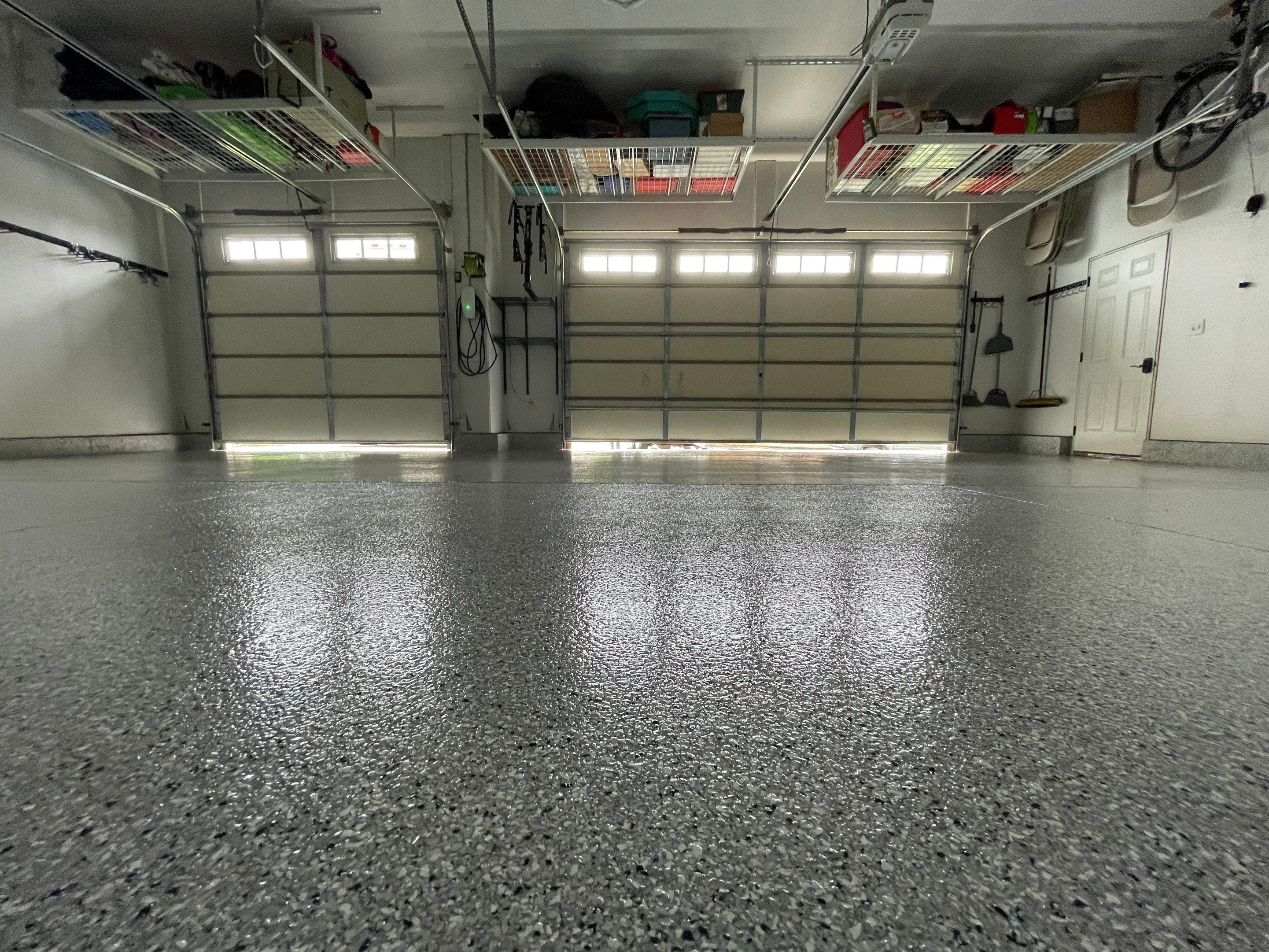 Feather Gray Epoxy Floor Coating Installation in Sioux Falls by Select Painting, Coatings & Garage Cabinets