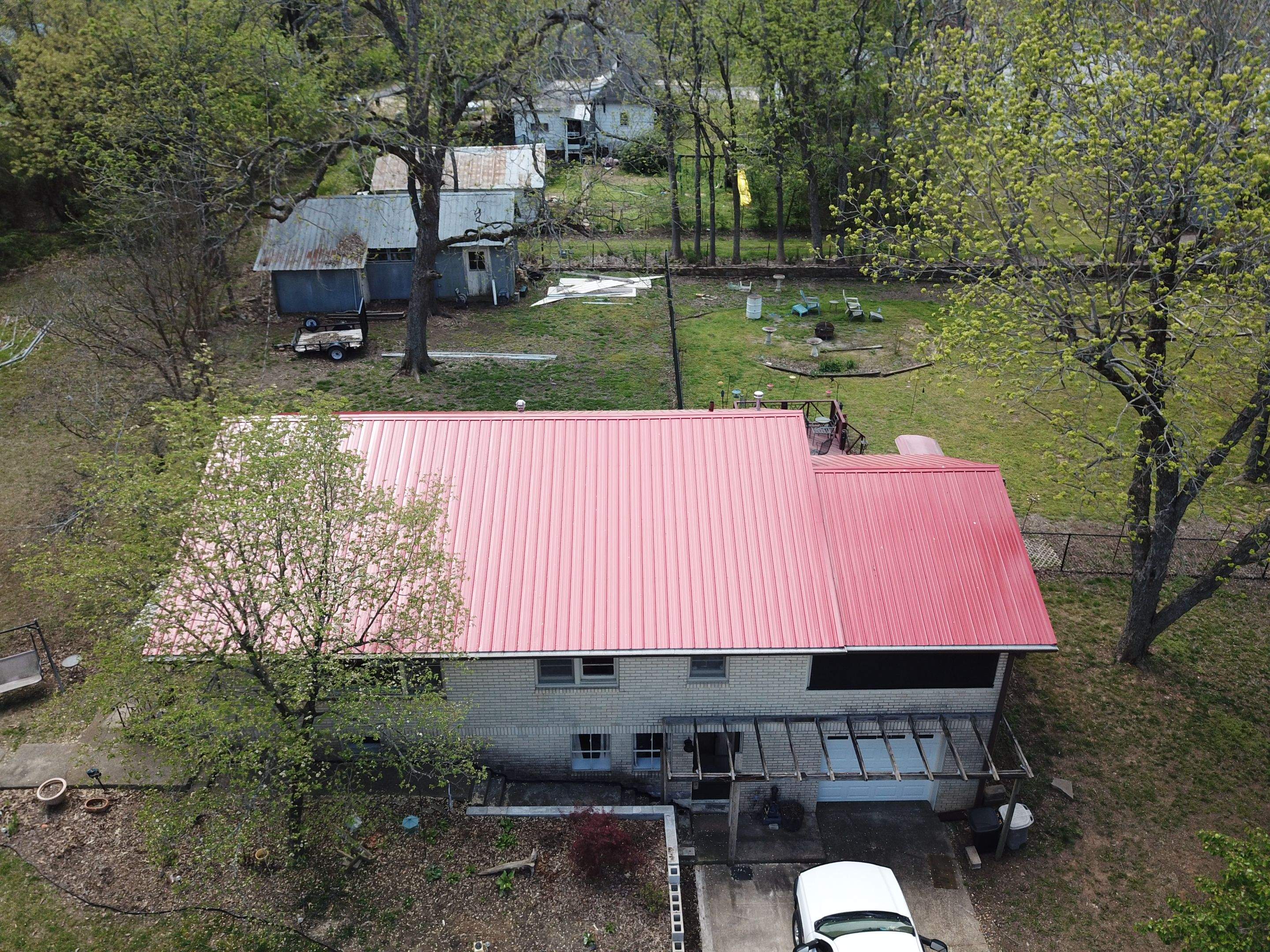 Residential Roofing Installation using 26 Gauge Colored Panels by Hostetler Roofing