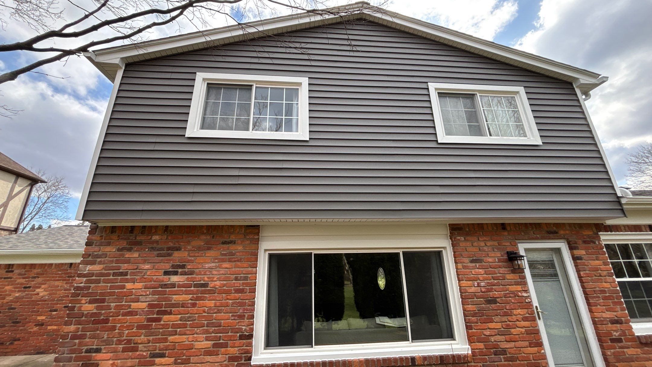 Siding Replacement using Alside Charcoal Smoke and Roof Replacement using Owens Corning Peppercorn by 180 Contractors