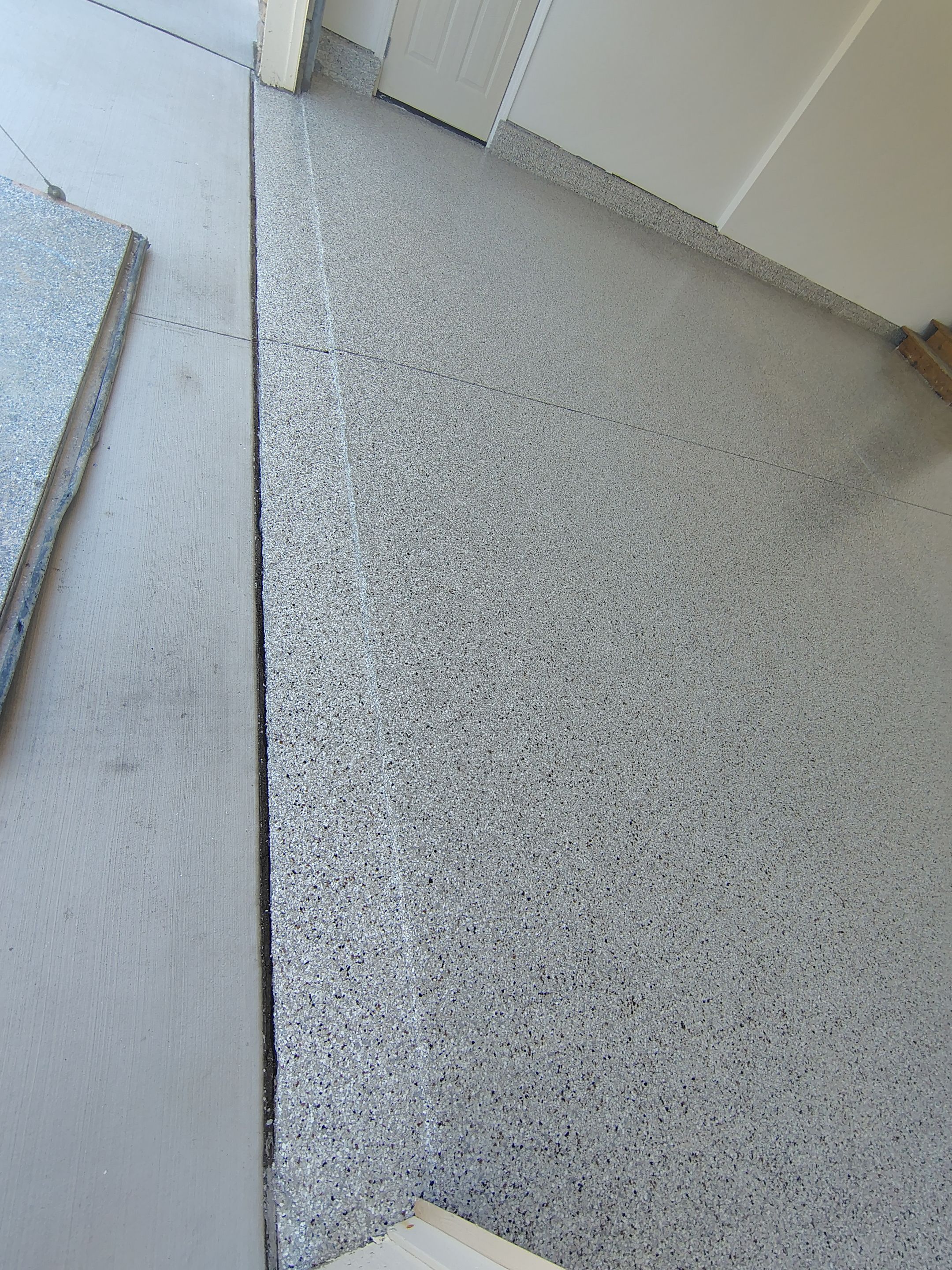 Custom Grey Speckled Epoxy Floor Coating for Sioux Falls Garage by Select Painting, Coatings & Garage Cabinets