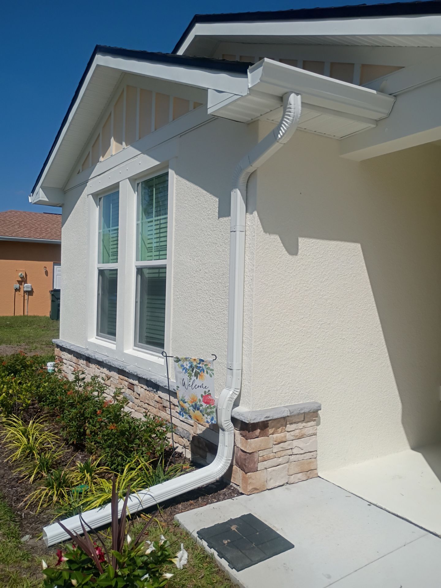 6-inch K-style White Seamless Gutters with Downspouts in North Port, FL by Gutter Professors