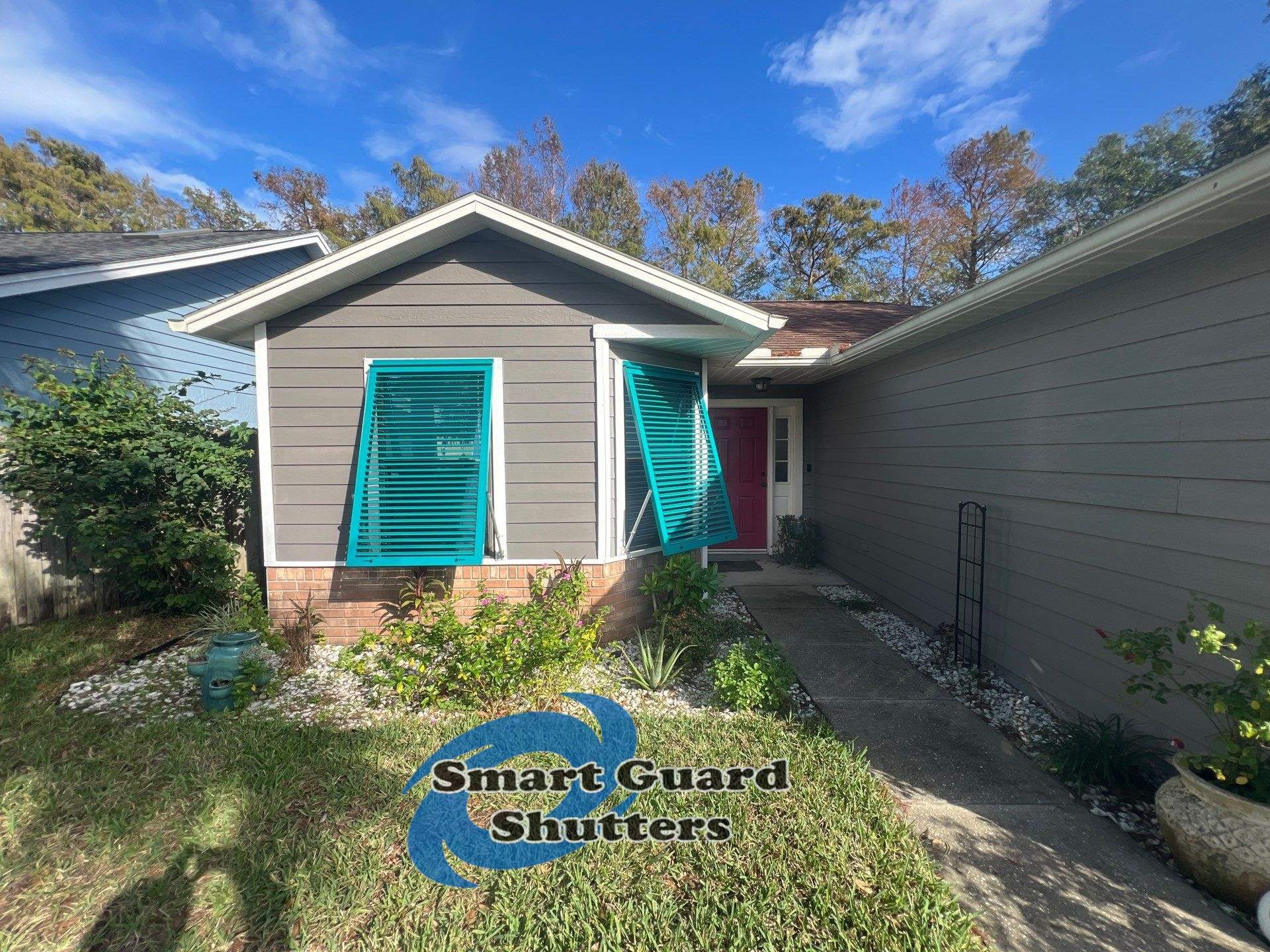 AstroGuard Hurricane Fabric in Tan & Impact Bahamas in Water Blue by Smart Guard Shutters