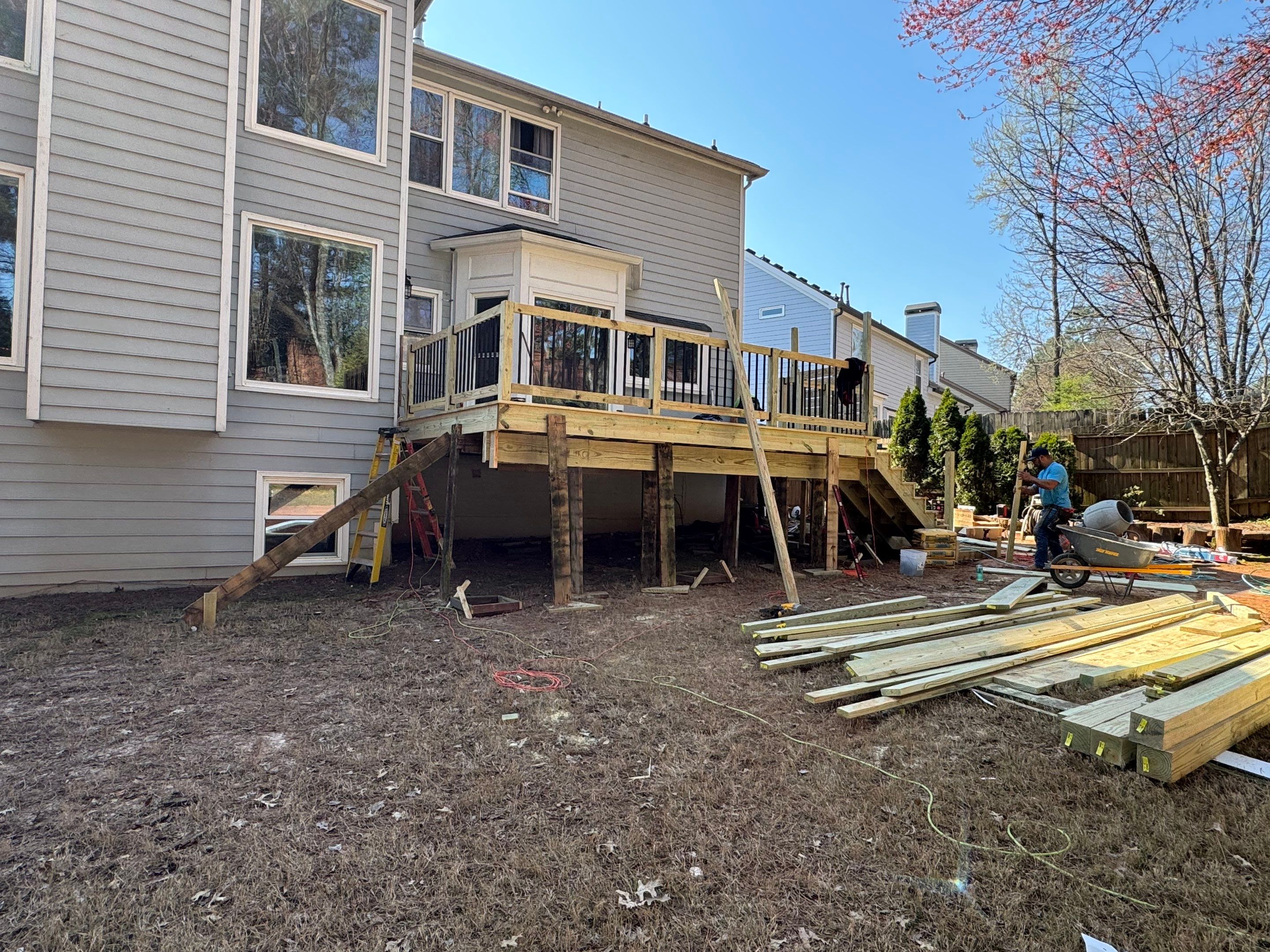 Elevated Deck Replacement with Black Metal Railings in Johns Creek by Swift Home Renovations