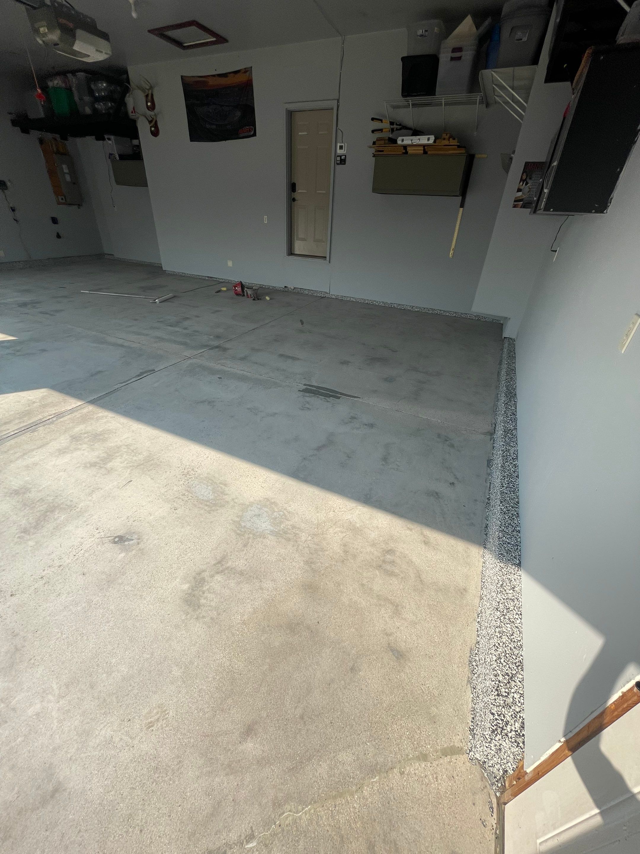 Sioux Falls Garage Concrete Coating Installation with Domino Flake by Select Painting, Coatings & Garage Cabinets
