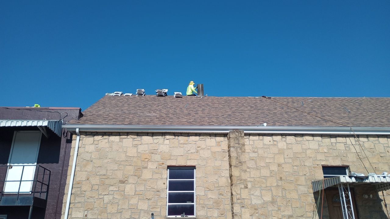 Commercial Roofing Installation using Performance Shingles by Mr. Roofer