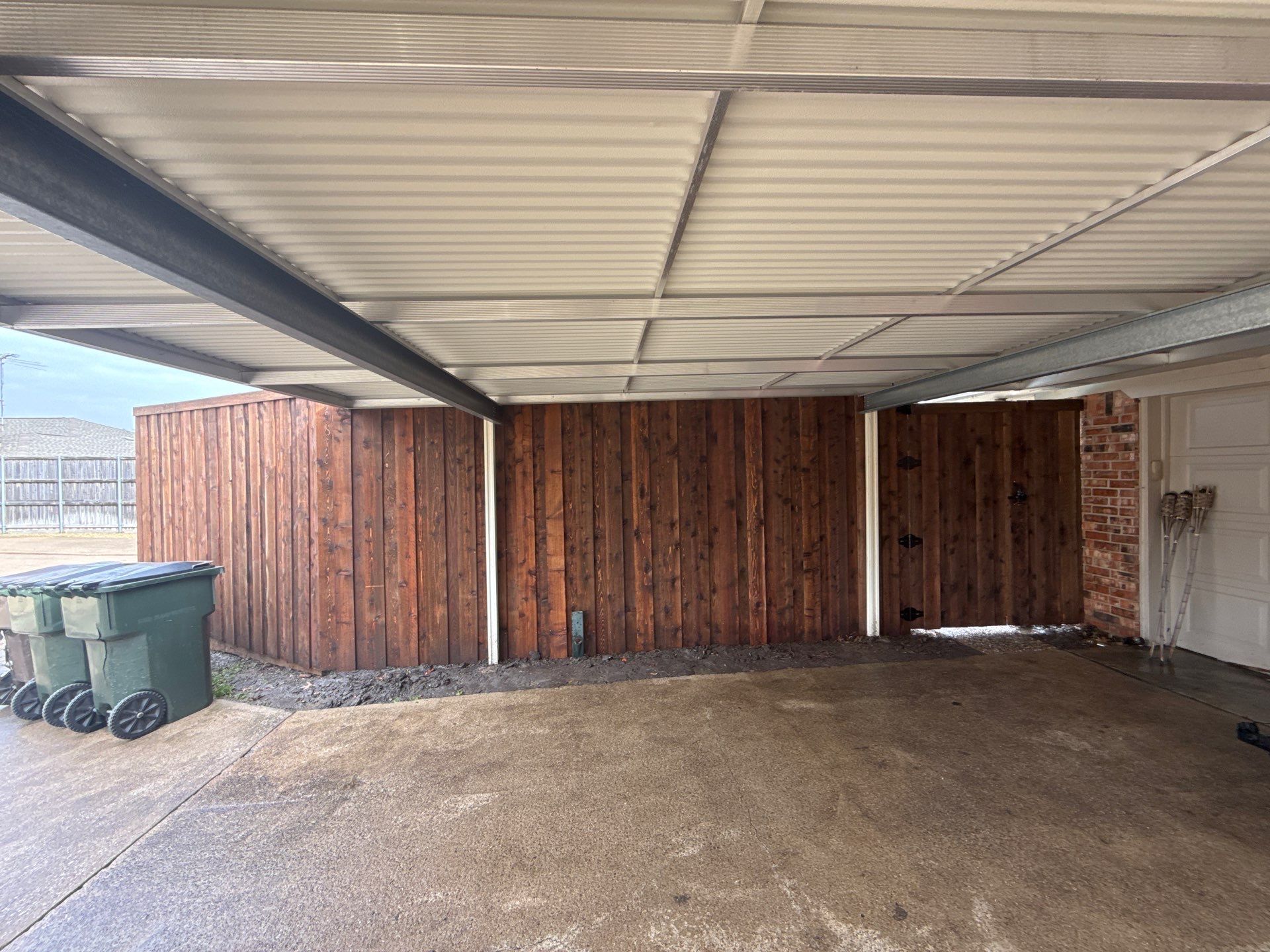 Pre-Stained board on board w/ trim and kickboard using 1x4 cedar trim by Grizzly Fence And Patio