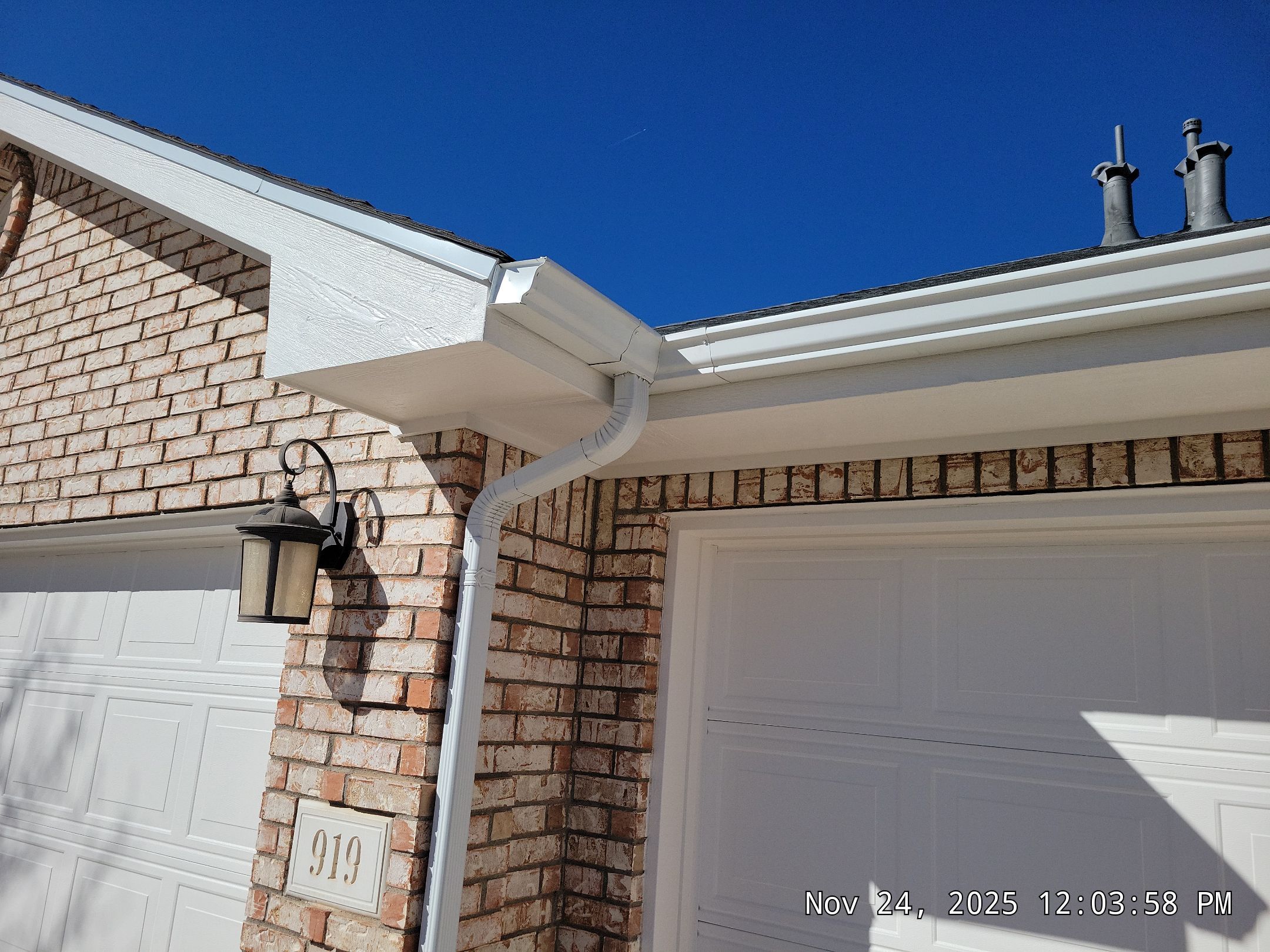 Seamless White Gutter and Downspout Installation in Albuquerque by Doyle Roof Masters Inc