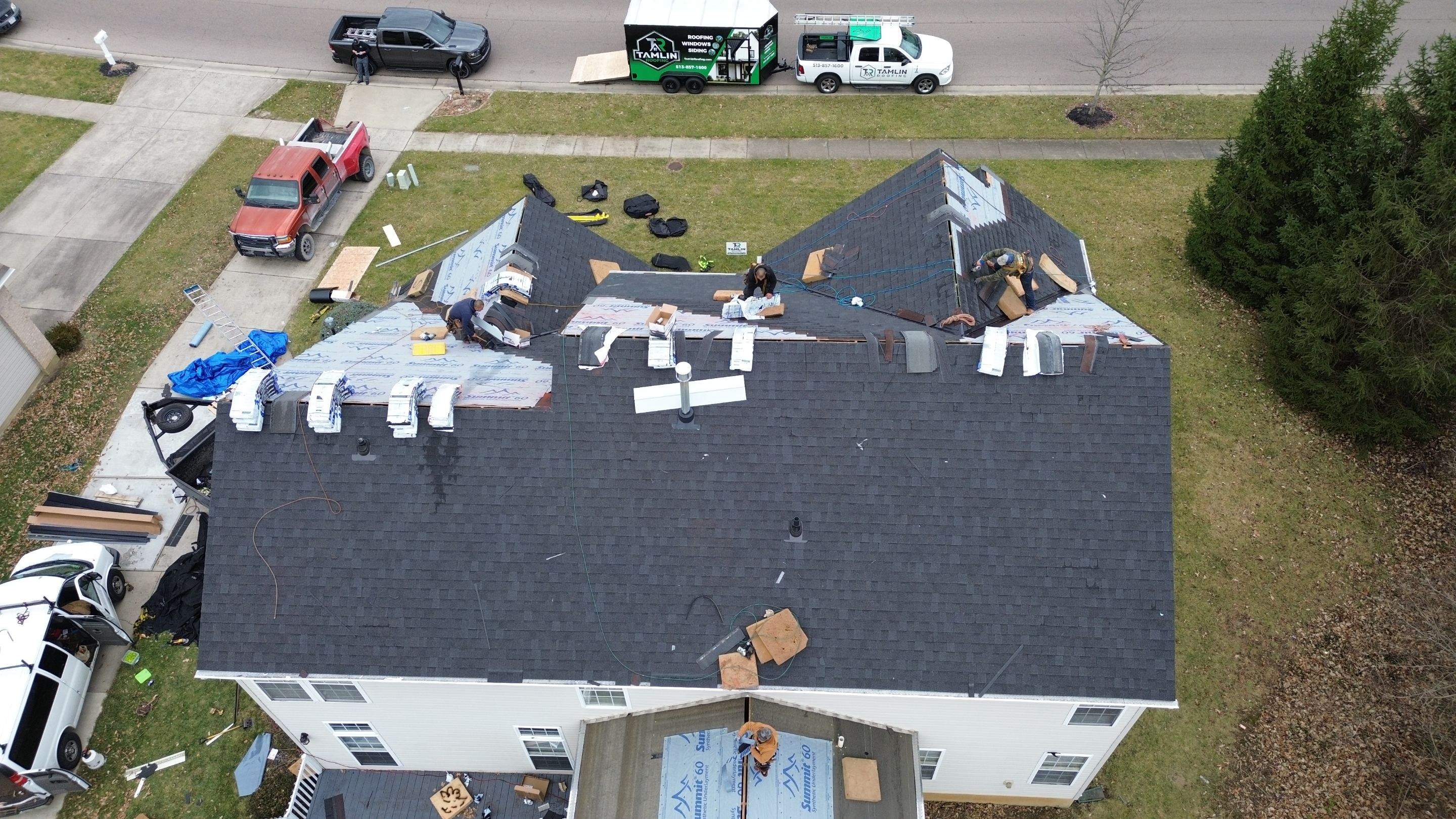 Walden Ponds - Pristine Black and Hydro Flo Gutter Guards by Tamlin Roofing