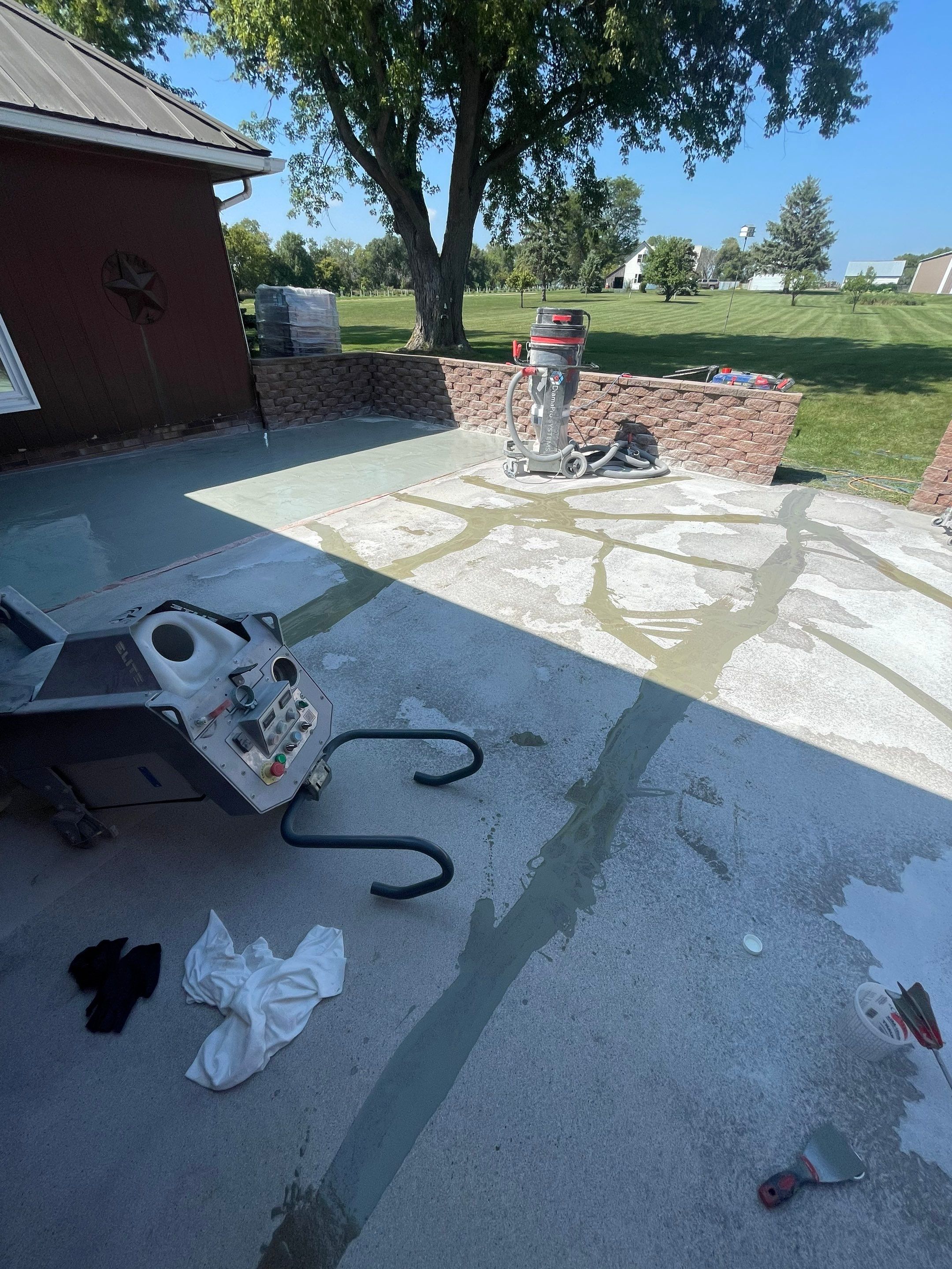 Concrete Patio Resurfacing and Protective Coating in Winfred, South Dakota by Select Painting, Coatings & Garage Cabinets