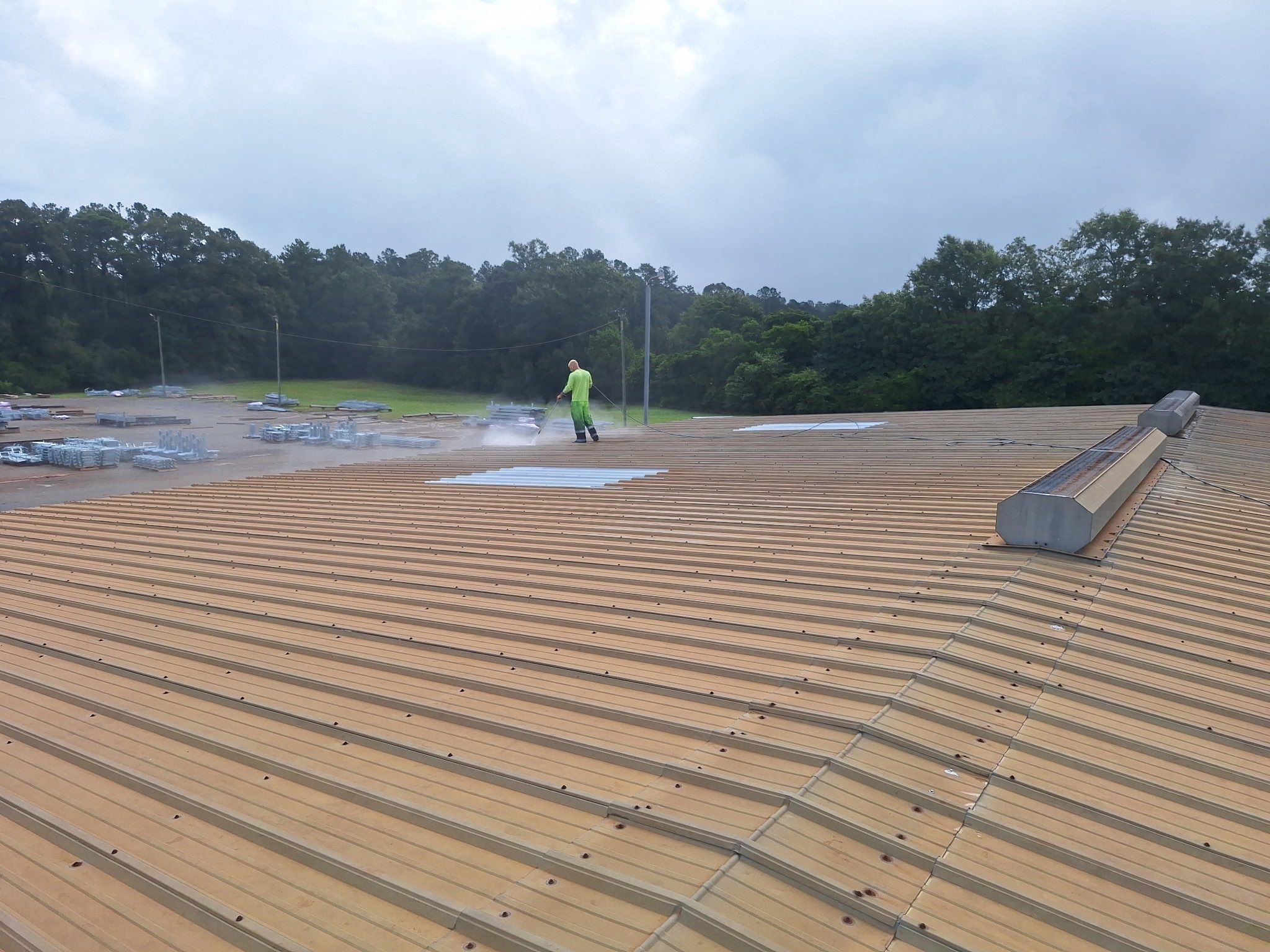 Commercial Metal Roof Restoration with White Protective Coating by Southern Roof Solutions