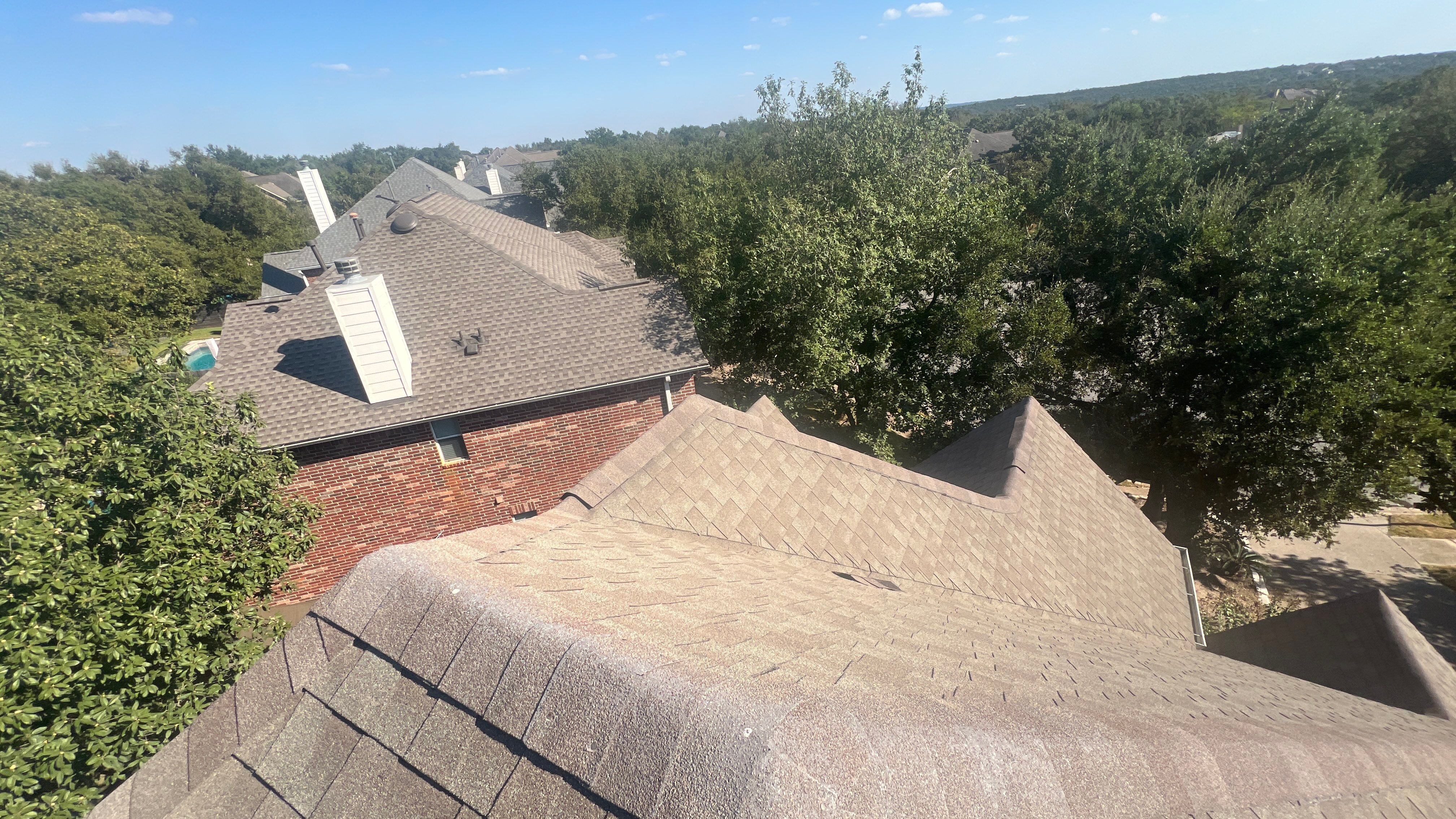 Asphalt Shingle Roof Replacement and Storm Damage Restoration in Austin by Caliber Restoration LLC