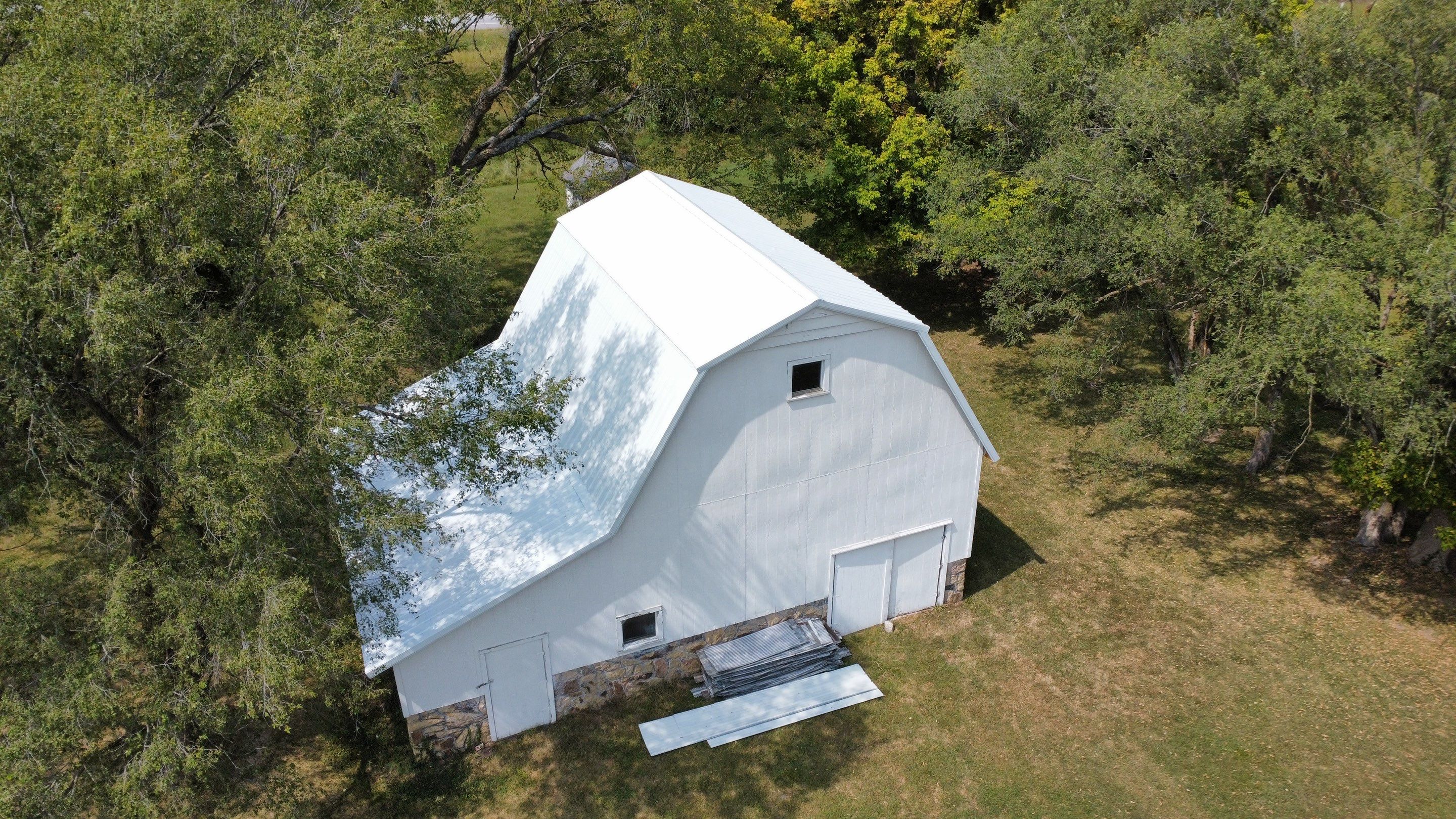 Residential Barn Roofing Install - 26 Gauge G-Rib Metal - Color bright White by Titan Commercial & Residential Roofing