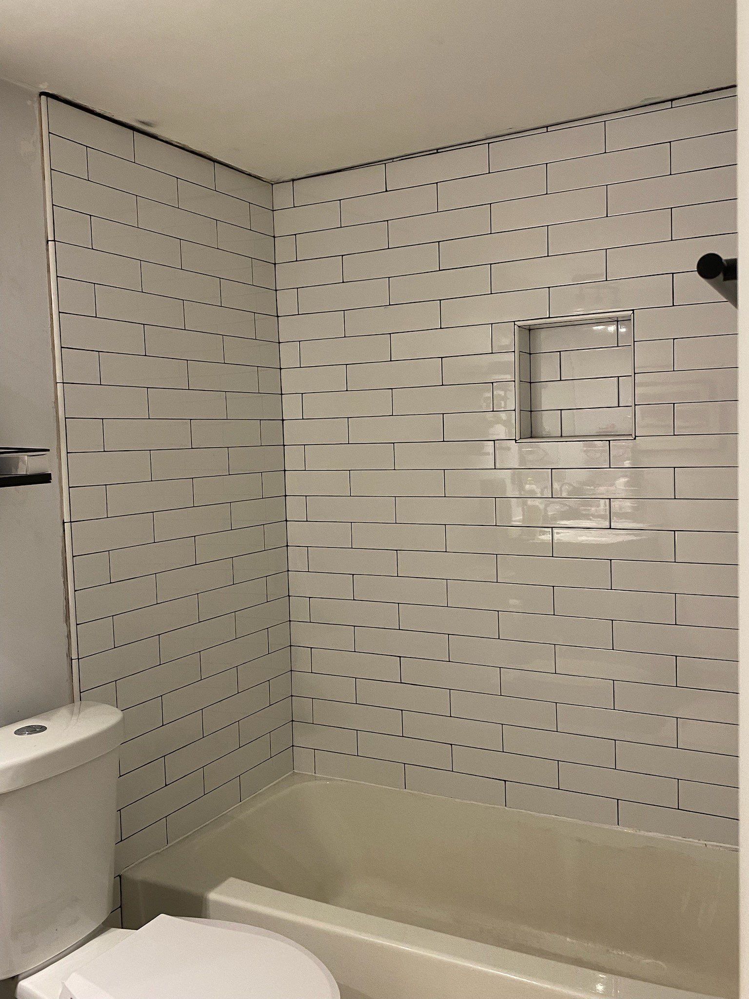 Brick pattern tiles for a bathroom and kitchen by Footprints Floors of Nashville