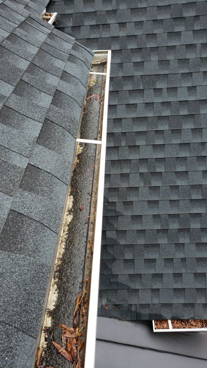 Gutter Cleaning using water by Power Wash Masters LLC