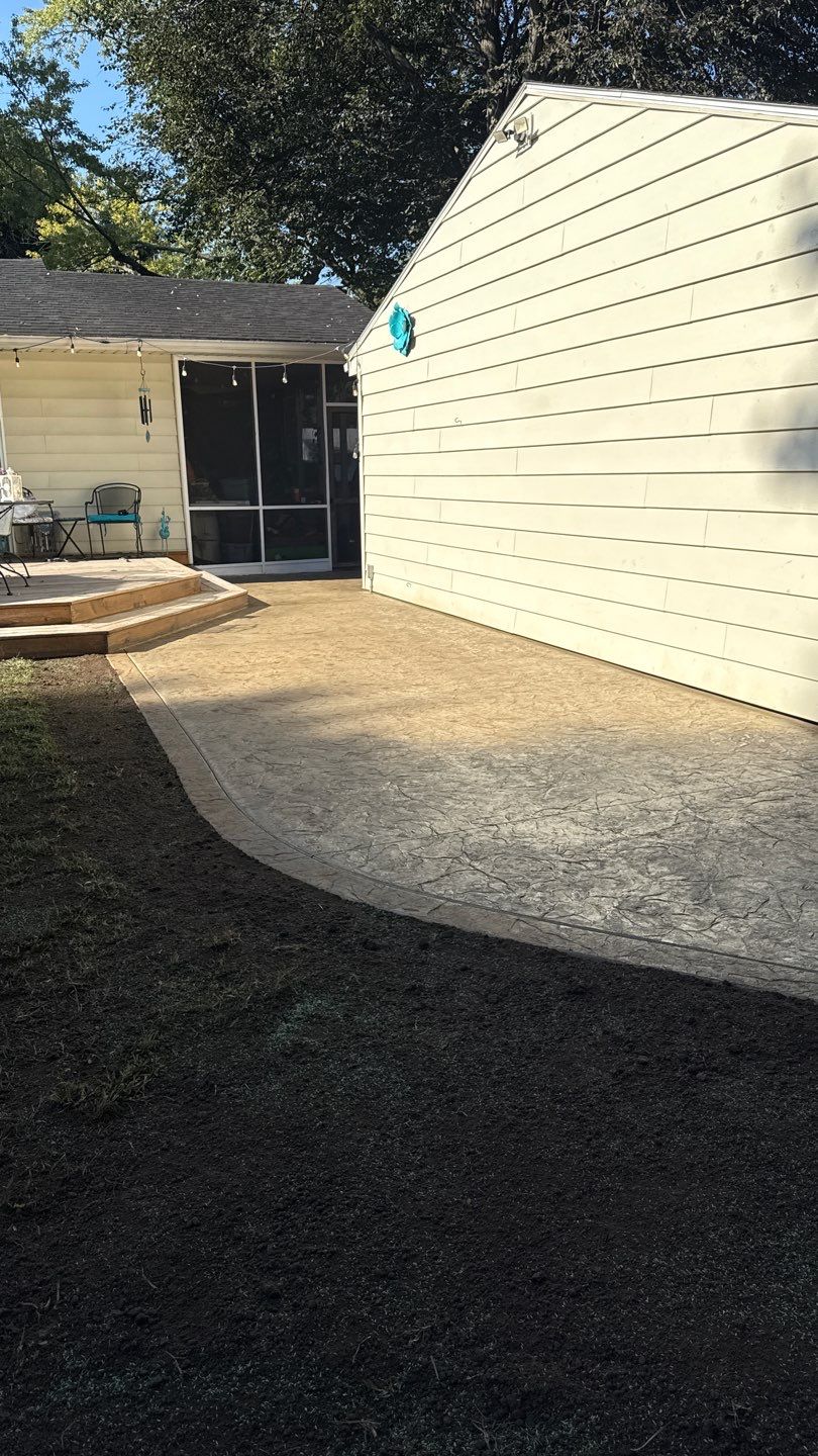 Oxford slate stamped patio  by NG Masonry & Construction LLC