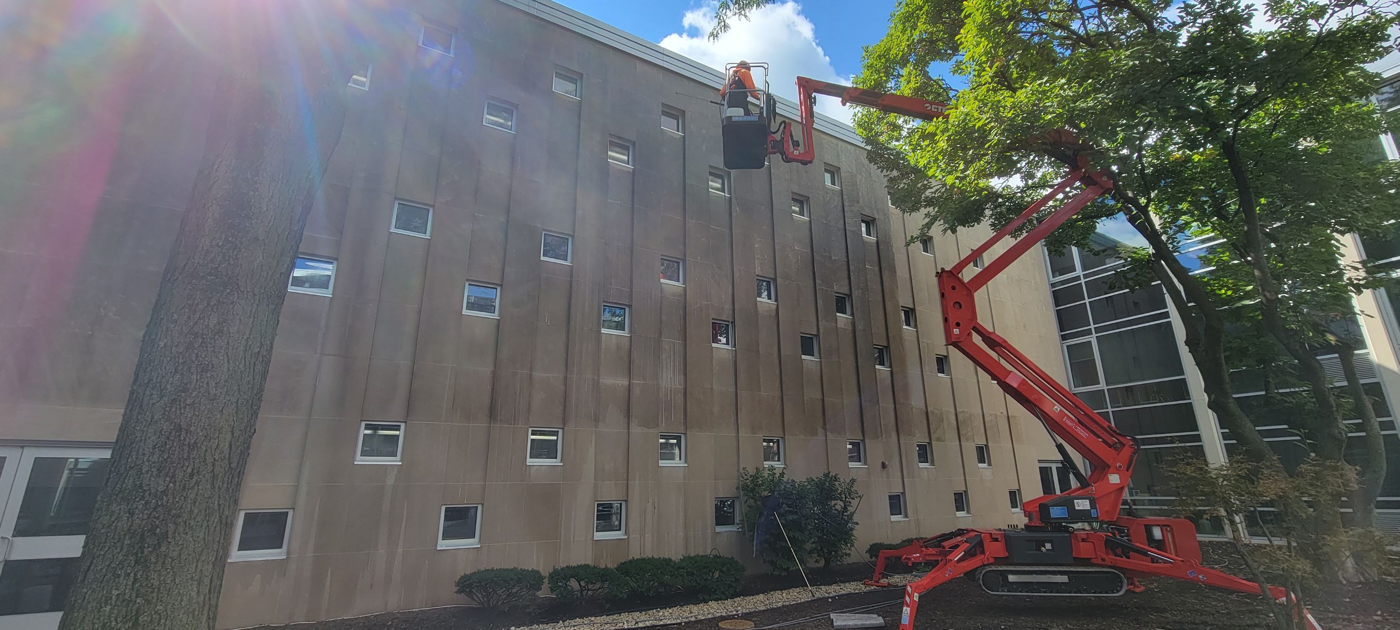 Courtyard pressure washing difficult access. by Northern Power Washing LLC.