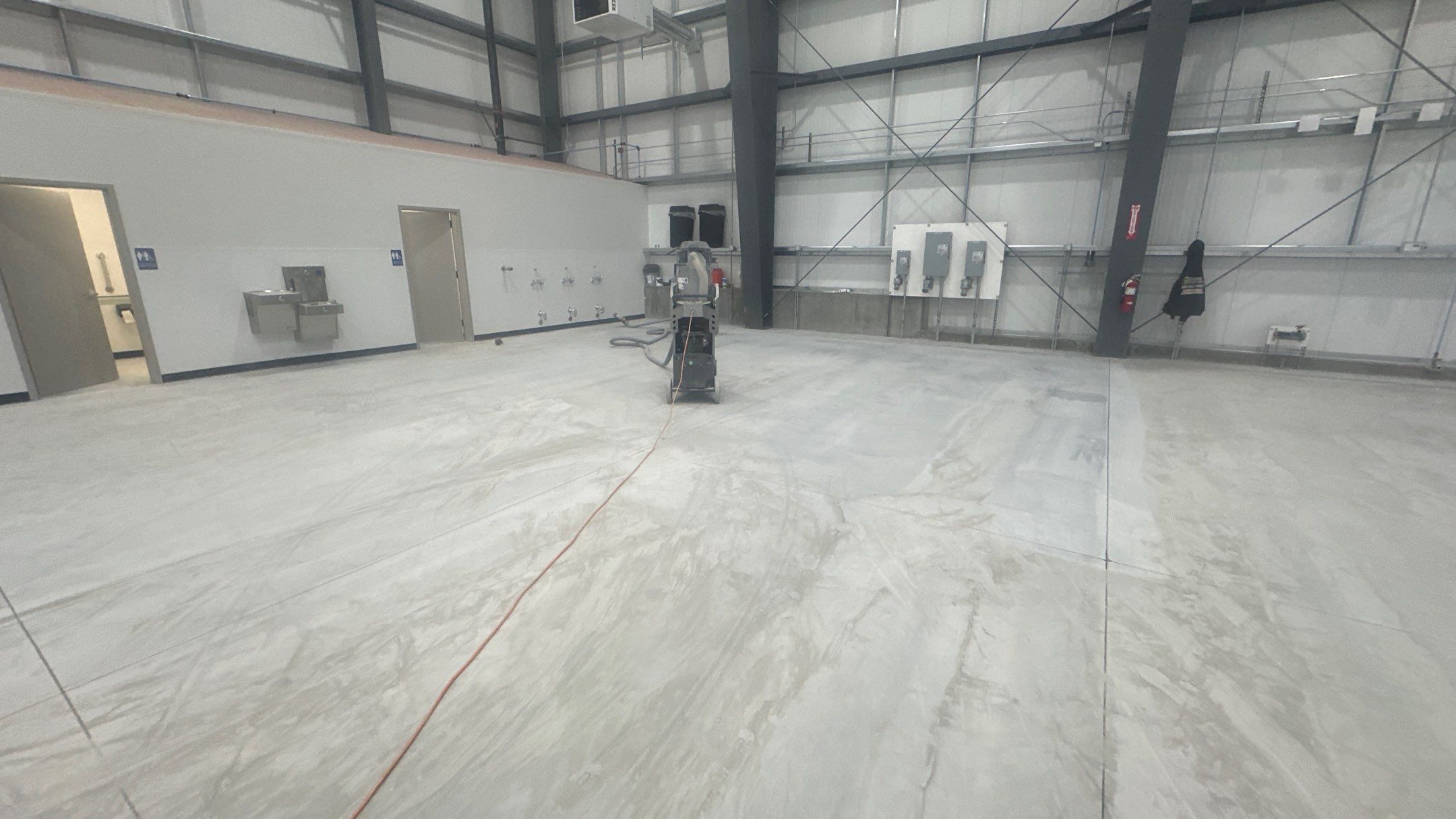 Airplane Hanger using Light Grey Commercial Penntek Epoxy by Croc Coatings, LLC