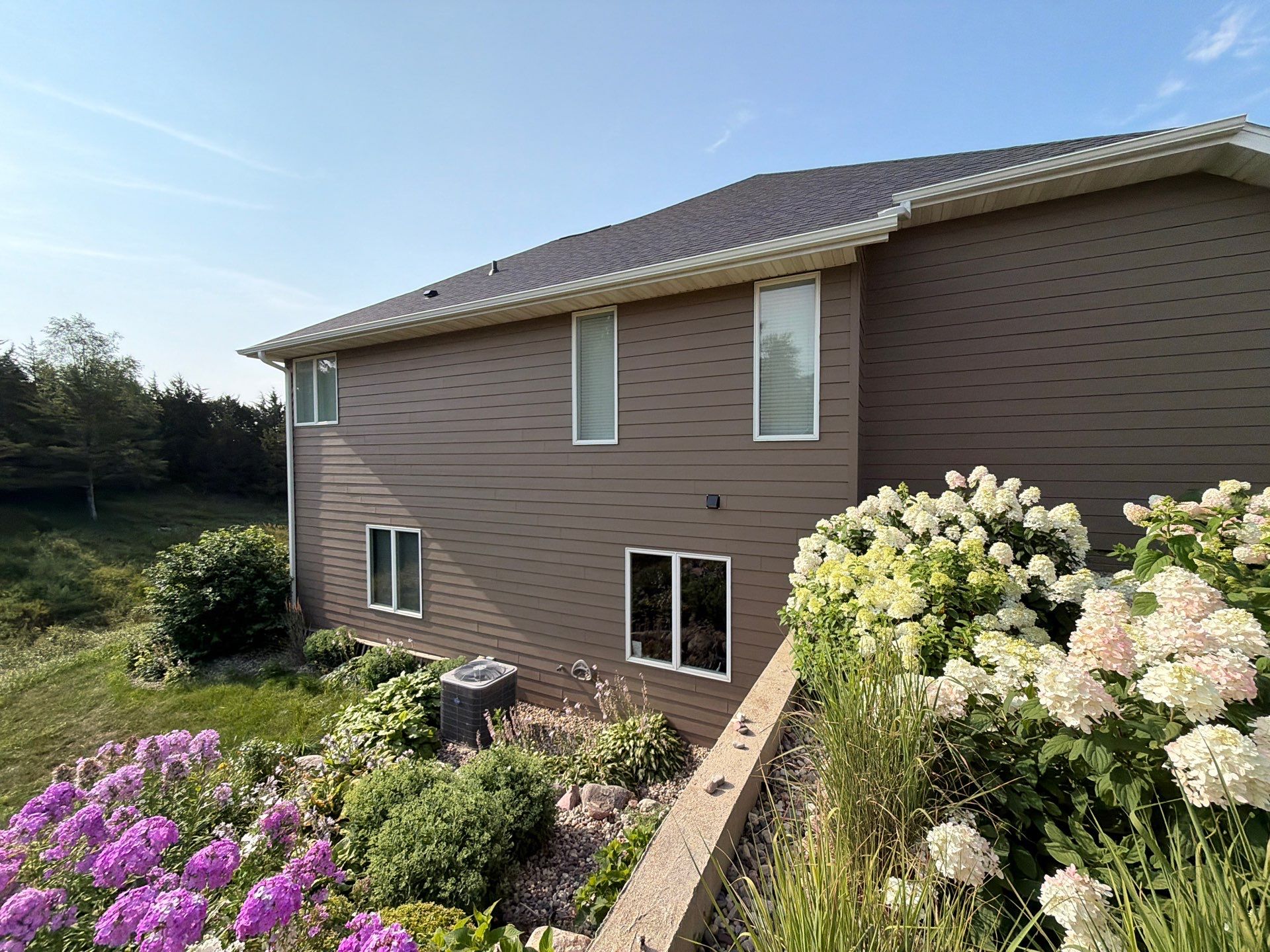 Sioux Falls Residential Exterior Painting and Siding Refresh by Select Painting, Coatings & Garage Cabinets