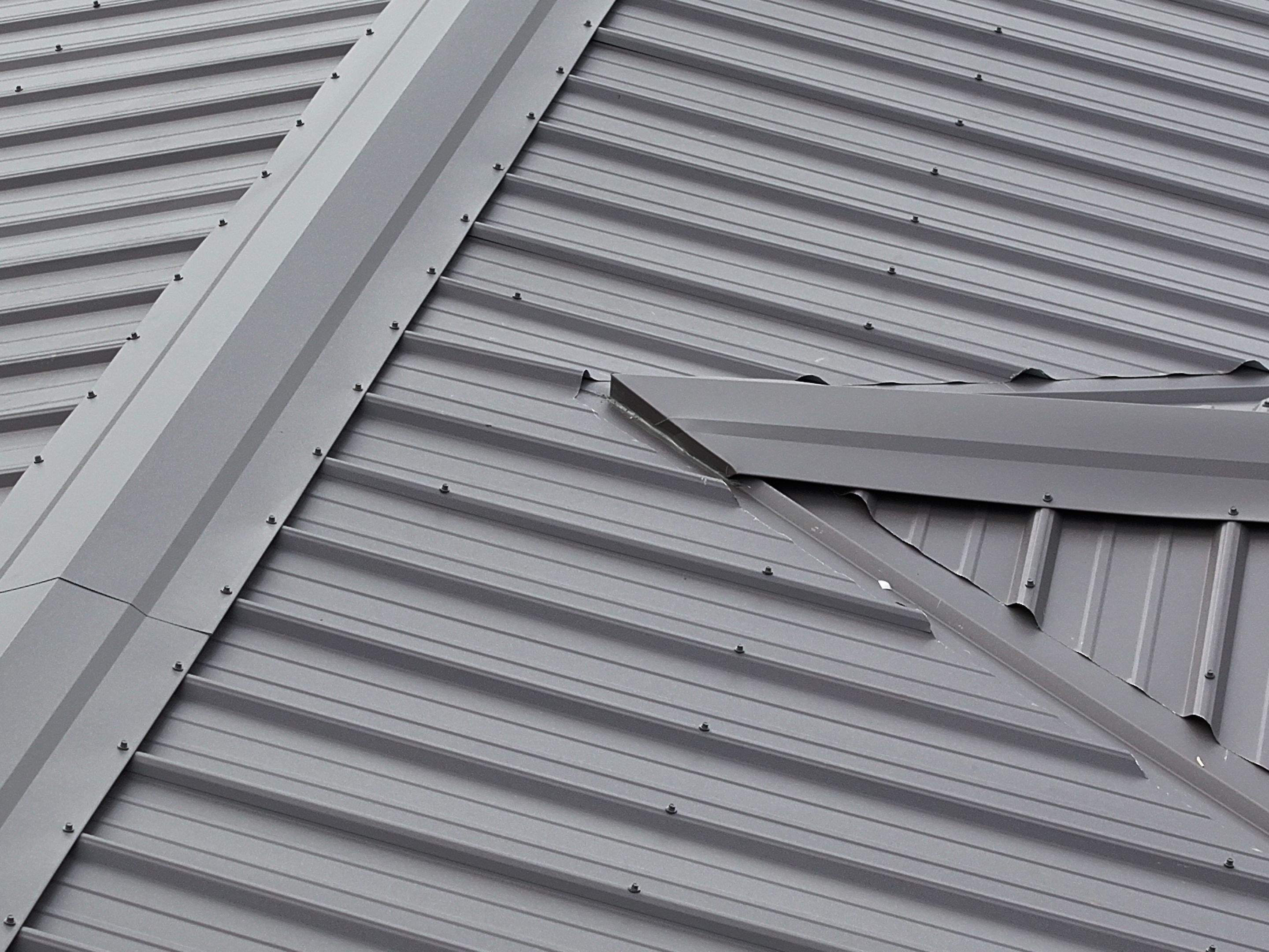 Charcoal Gray Textured Metal Roof by Omnia Roofing