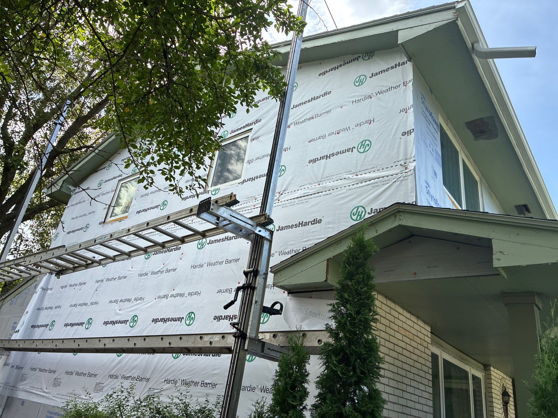 Full James Hardie Siding Replacement and Custom Exterior Paint in Papillion by Carps Complete Exteriors 