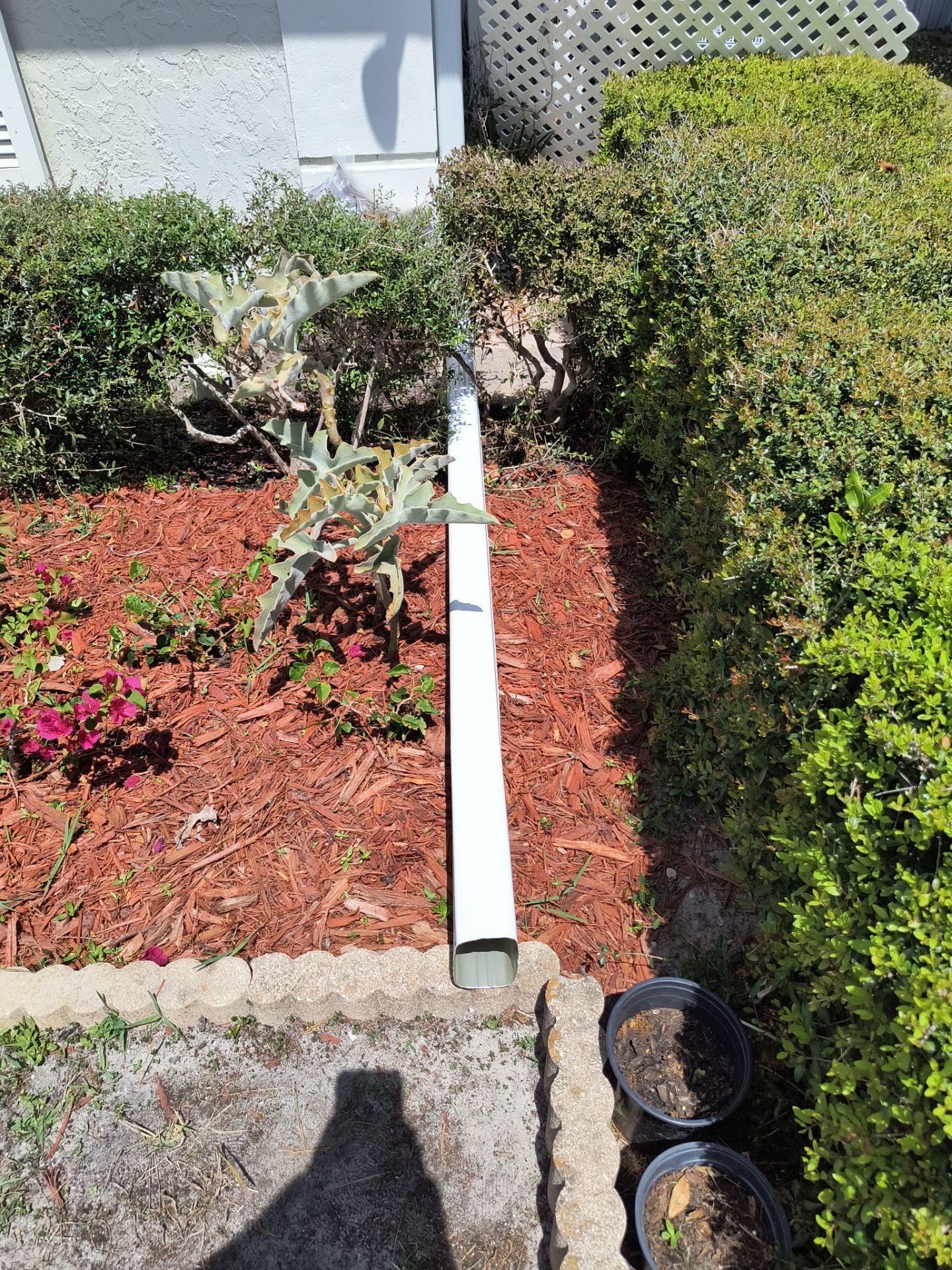 Gutter Project with White 6-K Seamless Gutters Installation and Downspouts in Sarasota FL by Gutter Professors