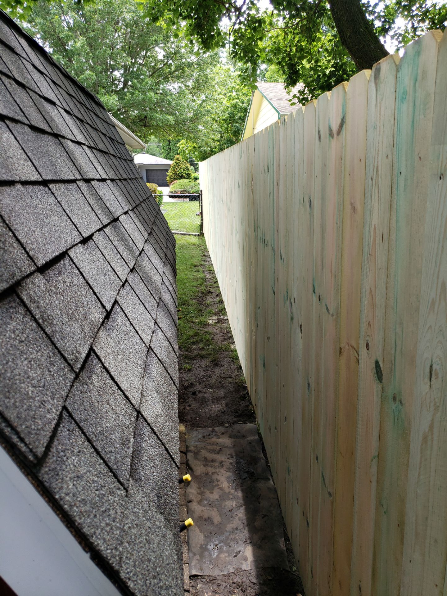 Custom Wood Privacy Fence Installation for Charles City Backyard by Perfect Picket Fence and Stain